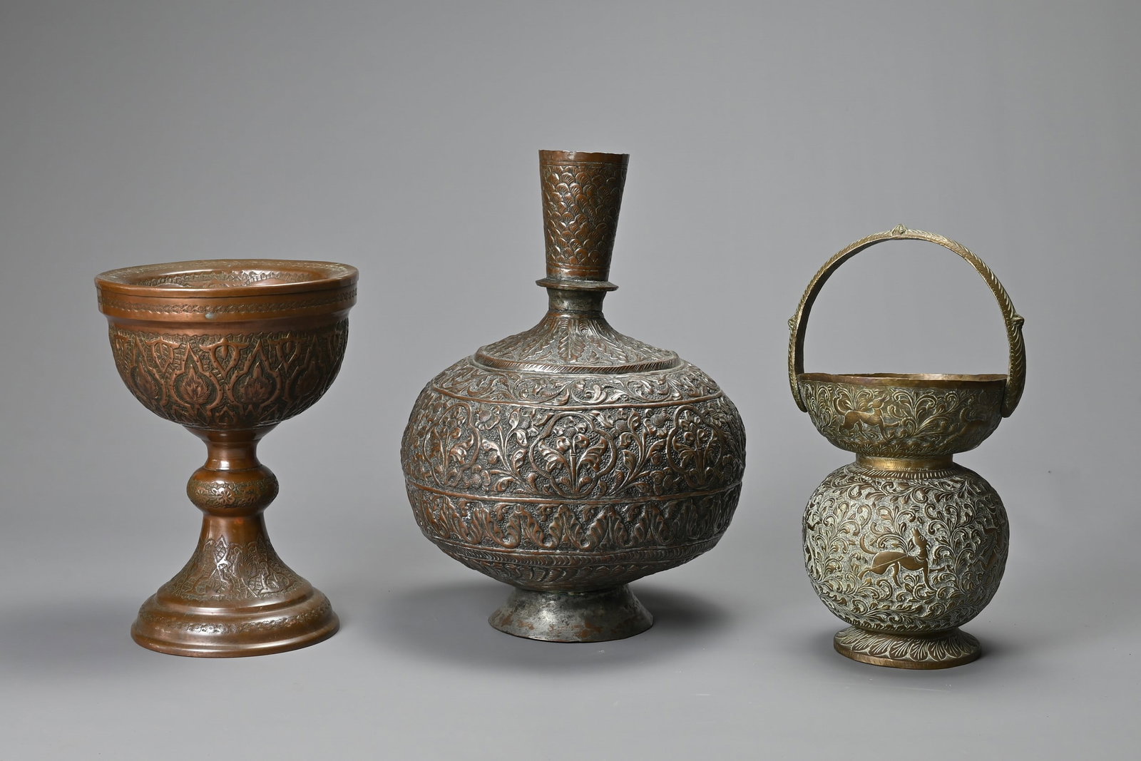 A LATE 19TH/EARLY 20TH CENTURY INDO-PERSIAN TINNED COPPER VASE, A BRASS GLOBULAR HANDLED VASE AND (1 of 7)