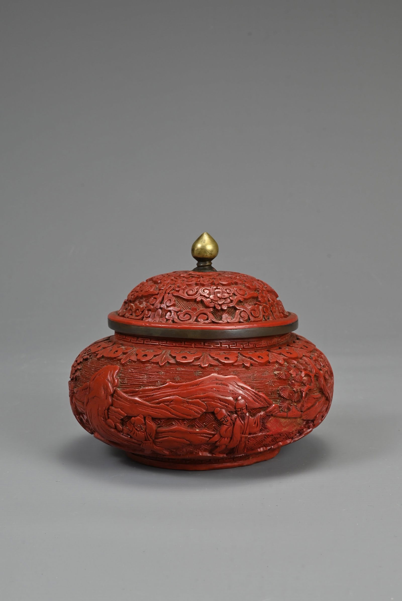 A CHINESE CINNABAR LACQUER POT AND COVER, 19TH CENTURY. Of squat form with domed cover carved in (1 of 7)