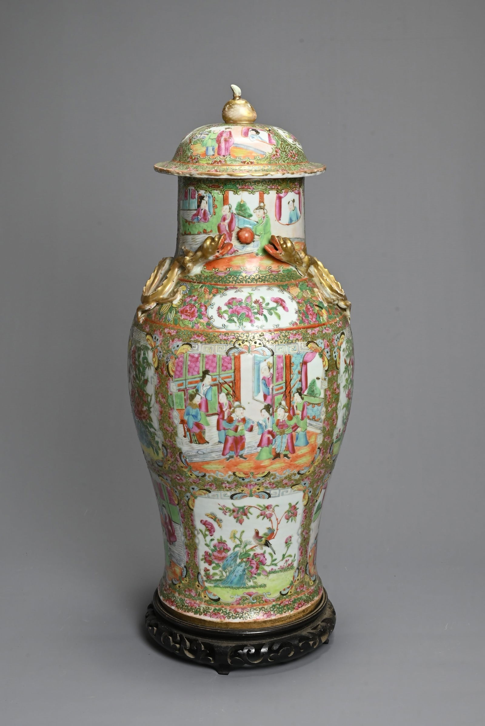 A LARGE CHINESE CANTON FAMILLE ROSE PORCELAIN VASE AND COVER, 19TH CENTURY. Of baluster form (1 of 7)