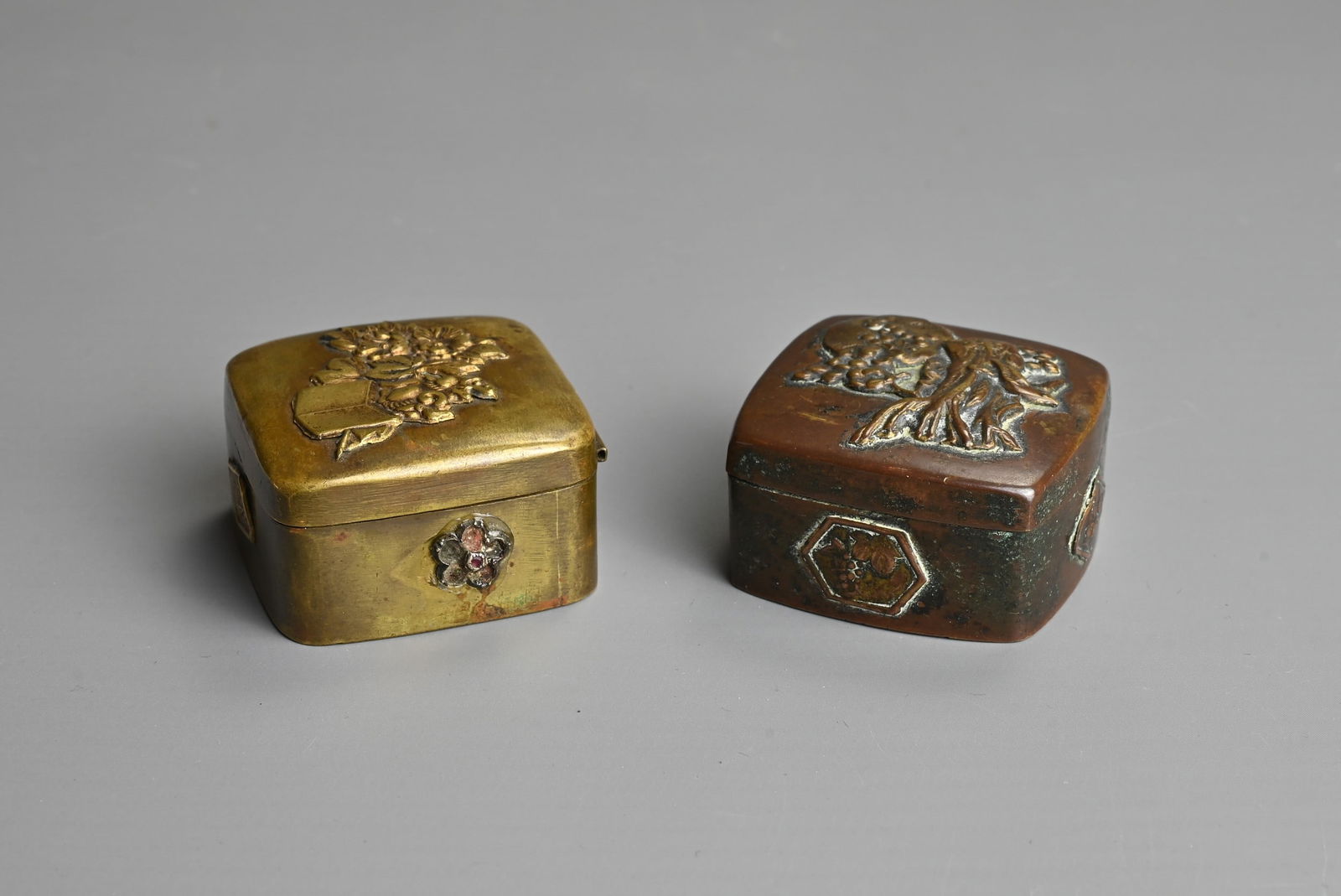 TWO JAPANESE MEIJI PERIOD (1868-1912) SMALL BRONZE SNUFF-BOXES. Each of square form, the first (1 of 6)
