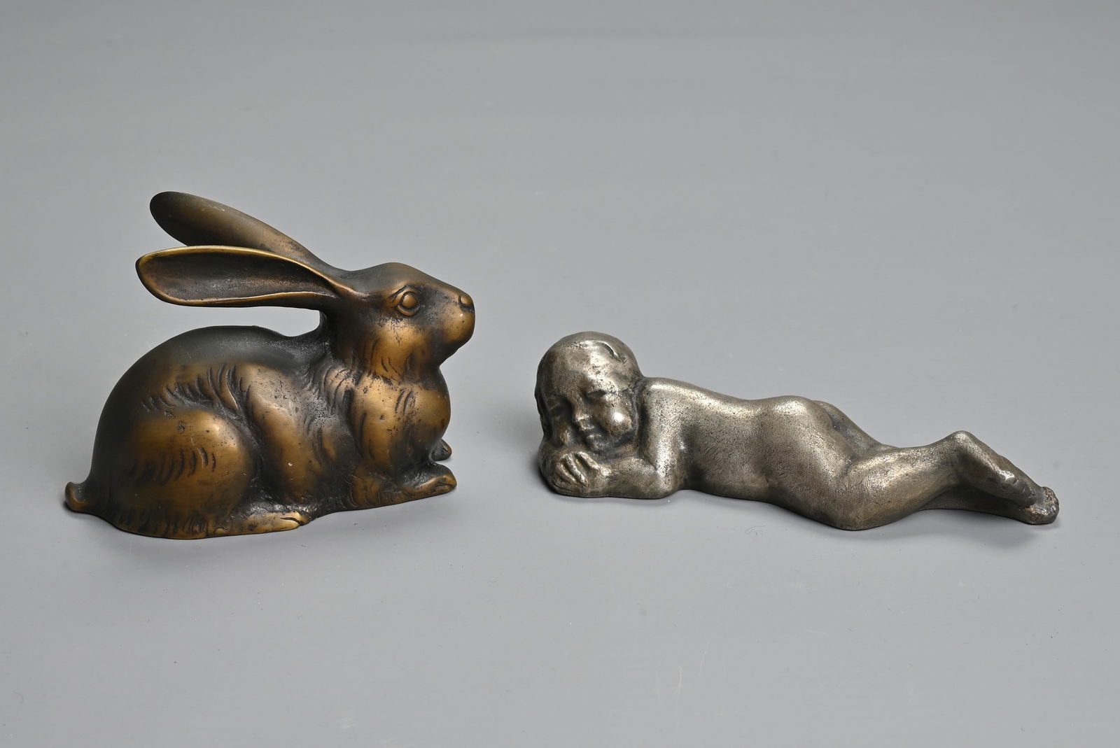 TWO 20TH CENTURY JAPANESE PAPERWEIGHTS. Comprising: a gilt bronze model of a recumbent rabbit, with (1 of 6)
