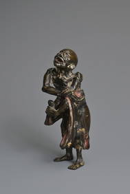 A CHINESE HEAVILY CAST BRONZE MODEL OF A LUOHAN, 17/18TH CENTURY. The emaciated figure stood holding (1 of 8)