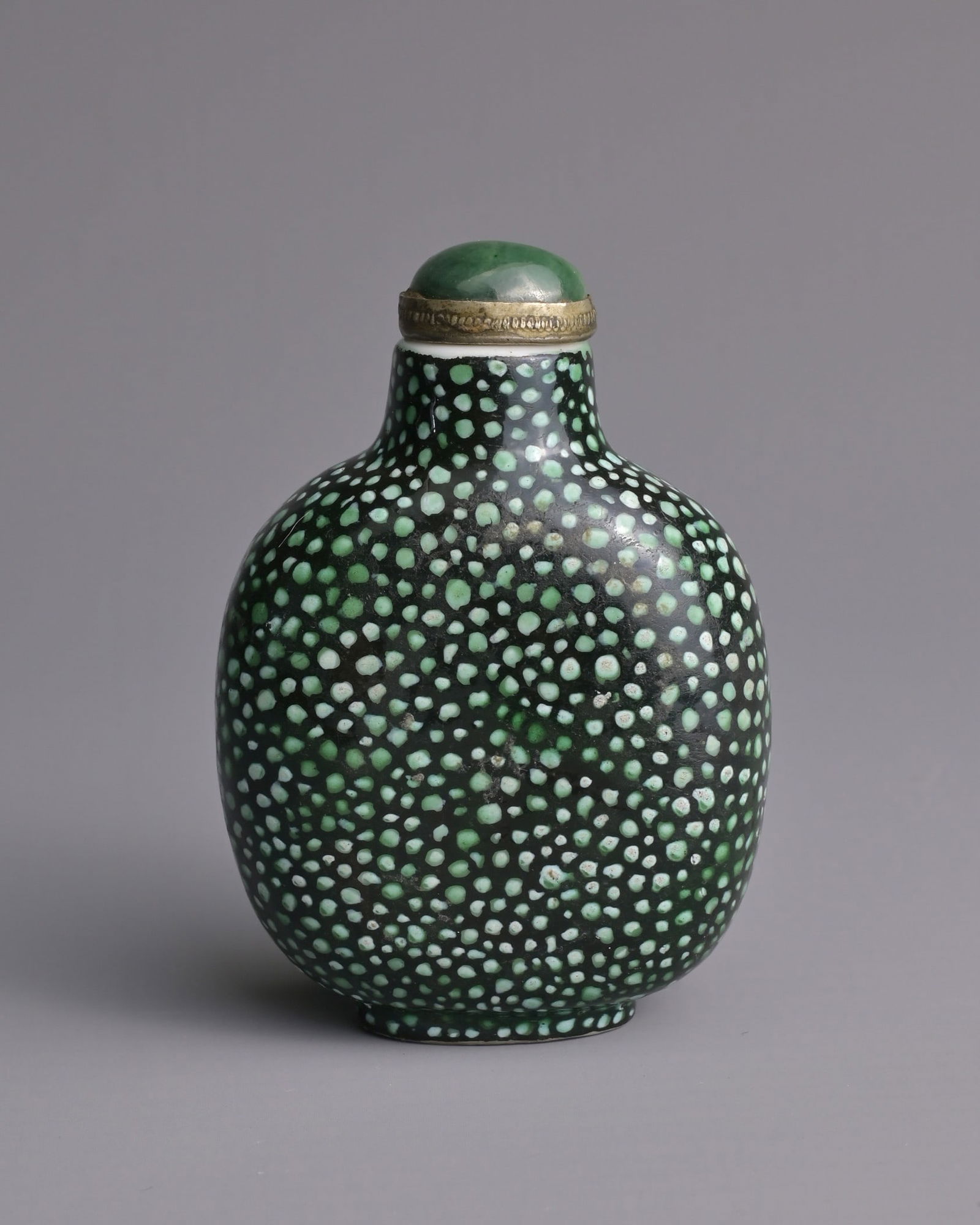 A CHINESE SHAGREEN IMITATION PORCELAIN SNUFF BOTTLE, QING DYNASTY. Of flattened globular form (1 of 7)
