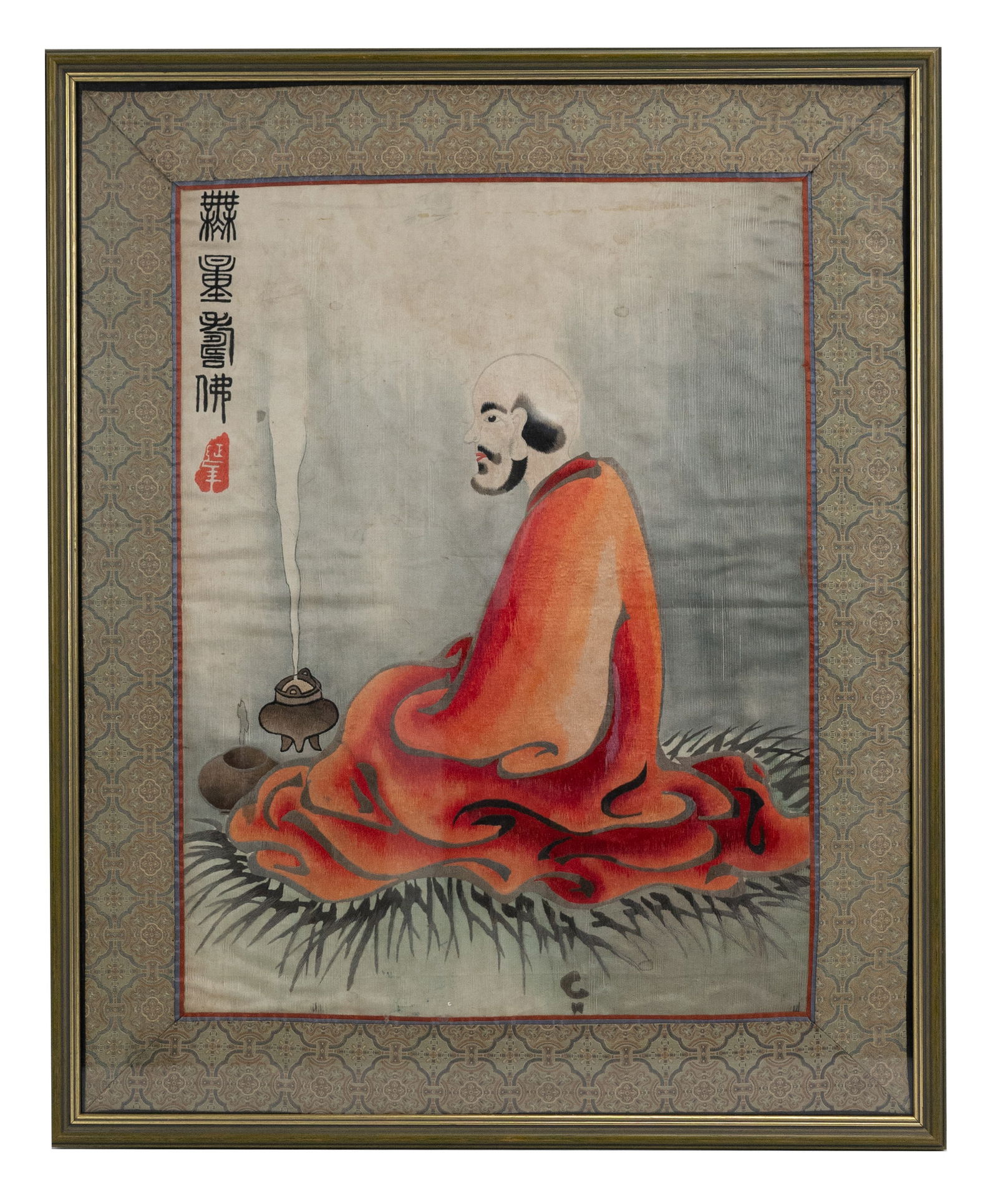A CHINESE FRAMED SILK EMBROIDERY OF LUOHAN, 20TH CENTURY. Figure of a monk dressed in orange robes (1 of 3)