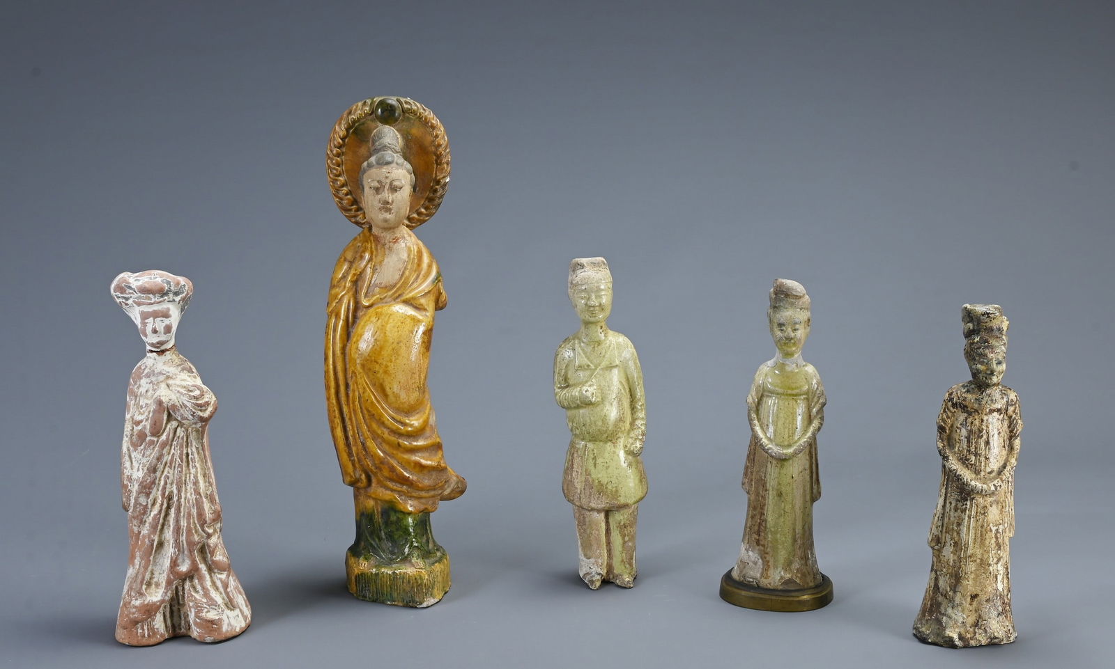 A GROUP OF CHINESE POTTERY FIGURES, TANG DYNASTY AND LATER. To include two lime glazed pottery (1 of 16)