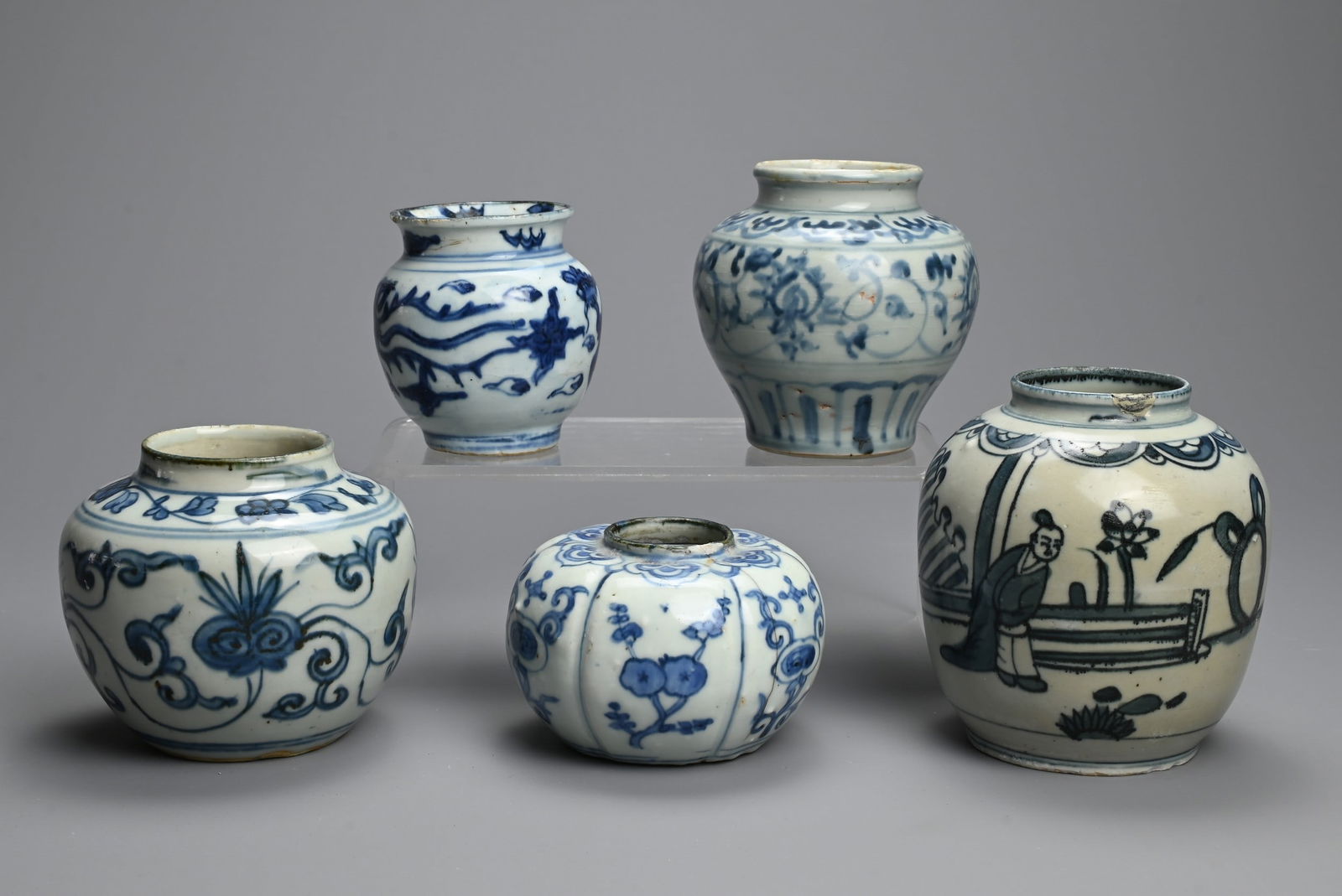 A GROUP OF CHINESE BLUE AND WHITE PORCELAIN JARS, MING DYNASTY. Five jars of various forms decorated (1 of 5)