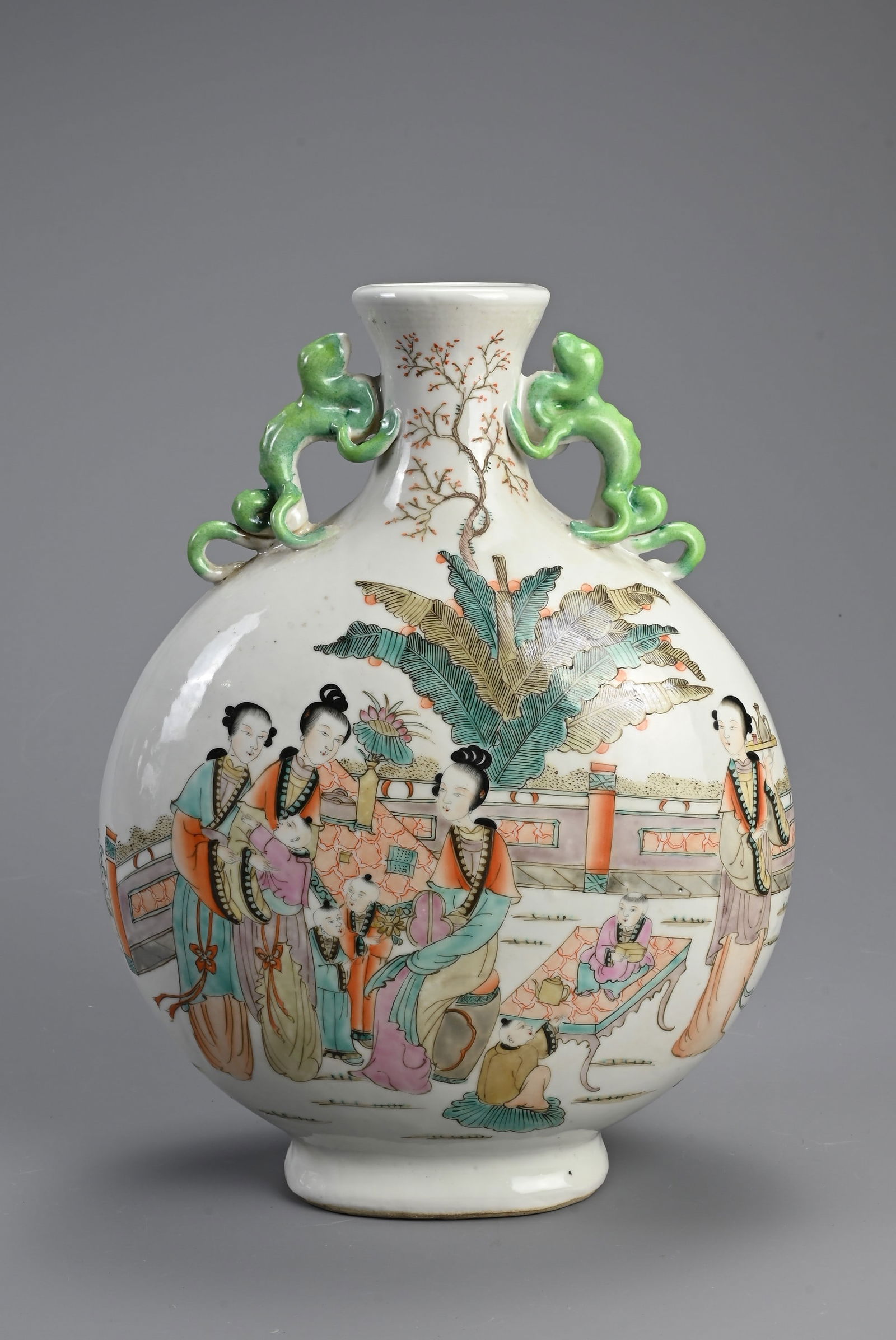 A CHINESE FAMILLE ROSE PORCELAIN MOONFLASK. With green glazed chilong form handles, decorated with (1 of 6)