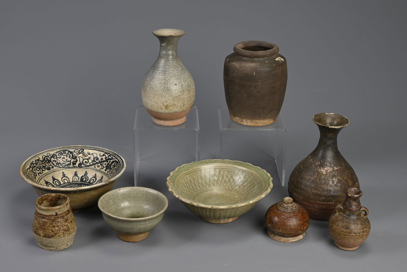 A GROUP OF SOUTH EAST ASIAN POTTERY VASES AND BOWLS. Including: a 19th century Thai or Vietnamese (1 of 4)