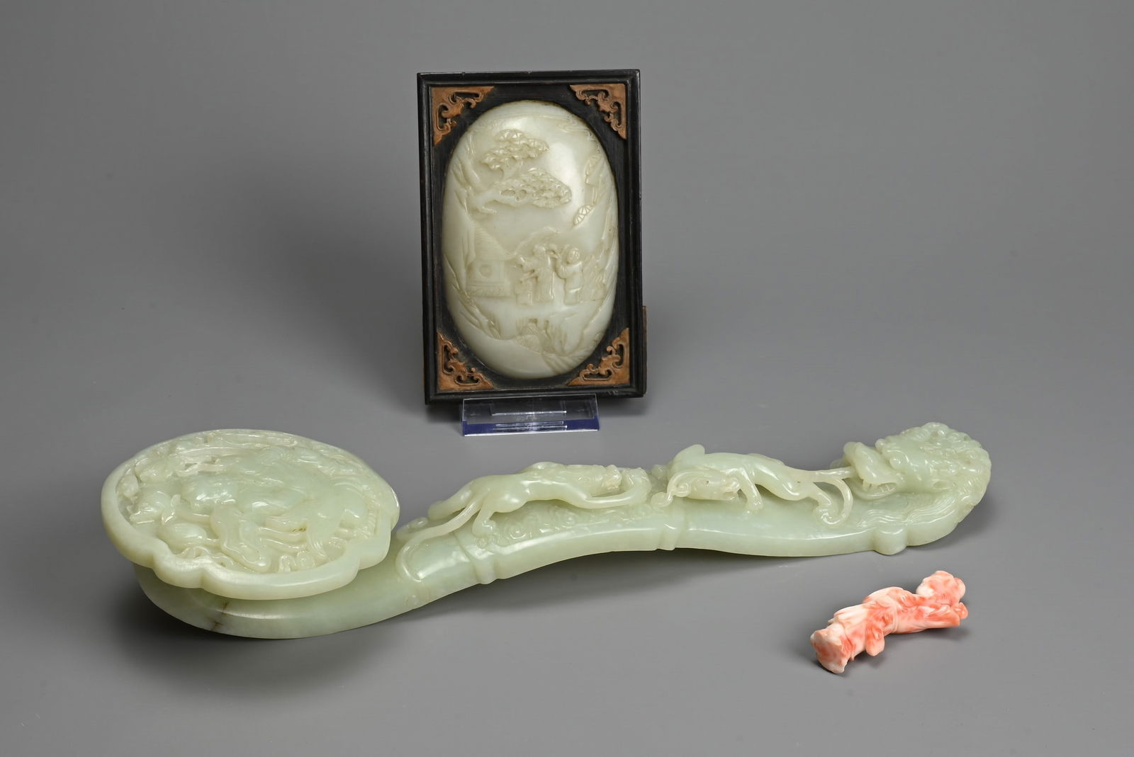 A CHINESE JADE RUYI SCEPTRE WITH MIRROR AND CORAL FIGURE. The ruyi sceptre carved in relief with boy (1 of 10)