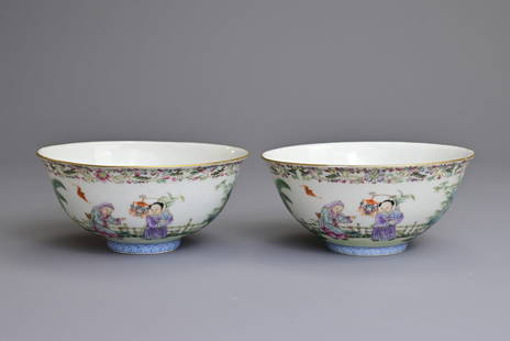 A PAIR OF CHINESE FAMILLE ROSE PORCELAIN BOWLS, REPUBLIC PERIOD, LIN ZHI CHENG XIANG. Finely: A PAIR OF CHINESE FAMILLE ROSE PORCELAIN BOWLS, REPUBLIC PERIOD, LIN ZHI CHENG XIANG. Finely decorated with children playing in a garden with rams. The interior decorated with a gilt Shou roundel surr