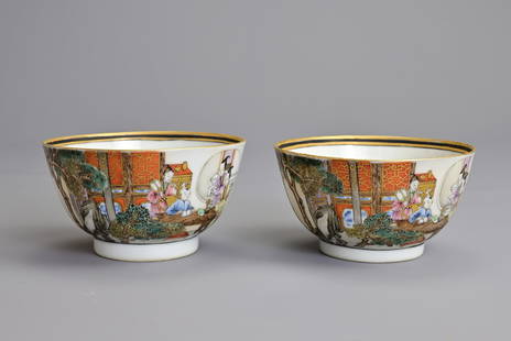 A FINE PAIR OF CHINESE FAMILLE ROSE PORCELAIN CUPS. Decorated with young boy at study with: A FINE PAIR OF CHINESE FAMILLE ROSE PORCELAIN CUPS. Decorated with young boy at study with attendants in a courtyard. The interior with peach sprays and a gilt and black enamel border at the rim. 8.7c