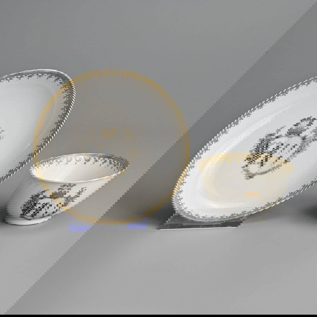 A CHINESE EXPORT ARMORIAL PORCELAIN TEABOWL AND SAUCER DECORATED WITH THE ARMS OF NORRIS, QIANLONG