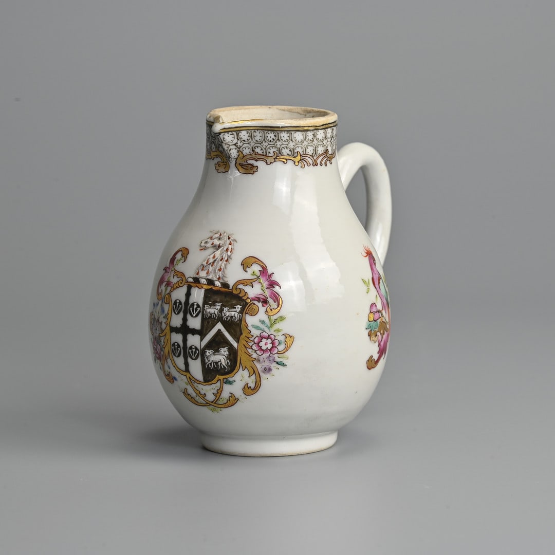 A CHINESE EXPORT ARMORIAL FAMILLE ROSE PORCELAIN BALUSTER MILK-JUG, QIANLONG (1736-1795).