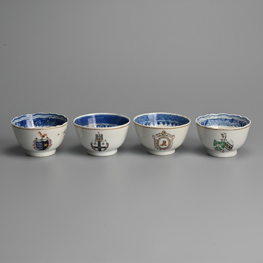 FOUR CHINESE EXPORT ARMORIAL AND CRESTED FAMILLE ROSE PORCELAIN TEABOWLS, QIANLONG (1736-1795).