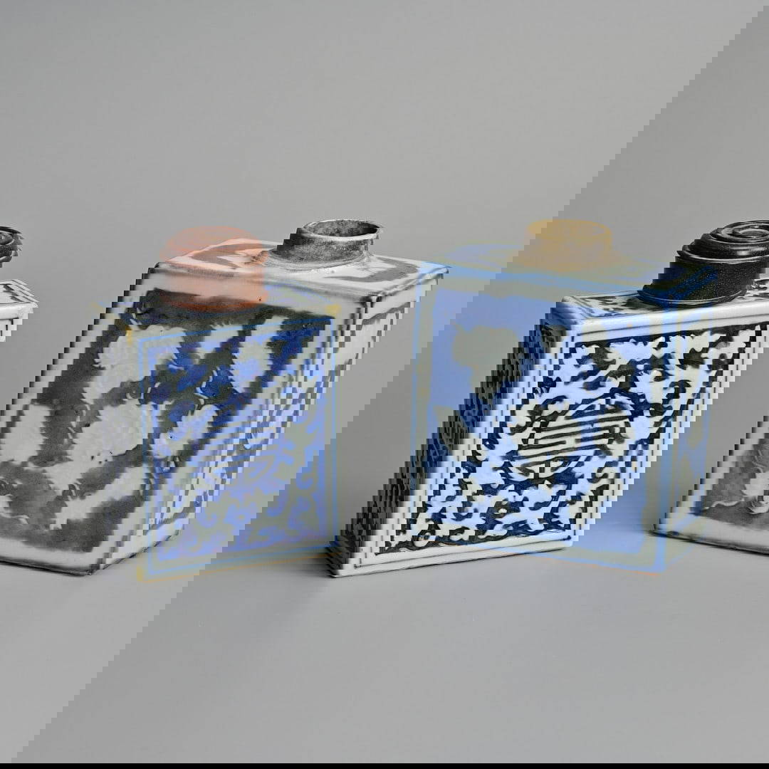 TWO CHINESE BLUE AND WHITE RECTANGULAR PORCELAIN TEACADDIES, 19TH CENTURY, ONE WITH LATER