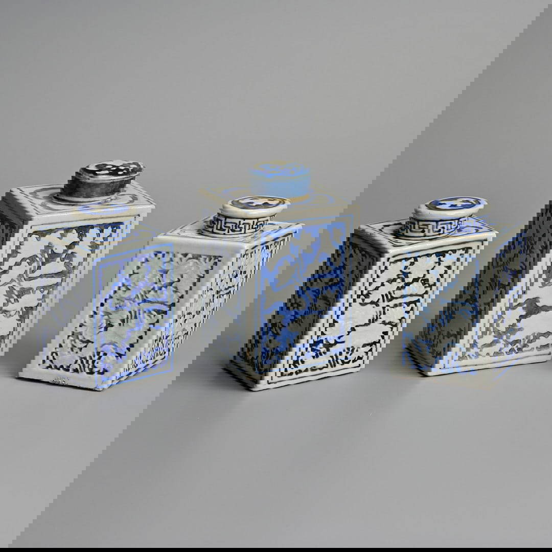 THREE CHINESE BLUE AND WHITE SQUARE SECTION PORCELAIN TEA CADDIES AND COVERS, 19TH CENTURY.
