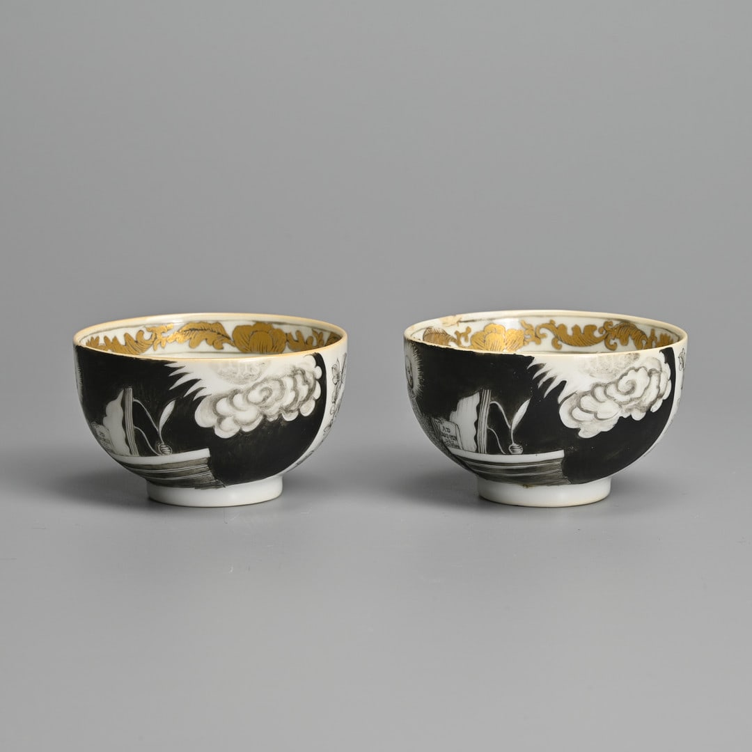 A PAIR OF CHINESE GRISAILLE AND GILT ST. IGNATIUS PORCELAIN CUPS, 18TH CENTURY.