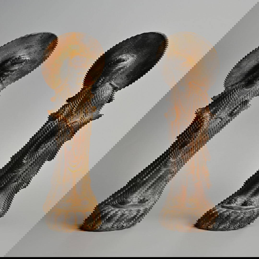 A PAIR OF CHINESE NORTHERN QI TYPE CARVED LIMESTONE FIGURES OF STANDING BODHISATTVA.