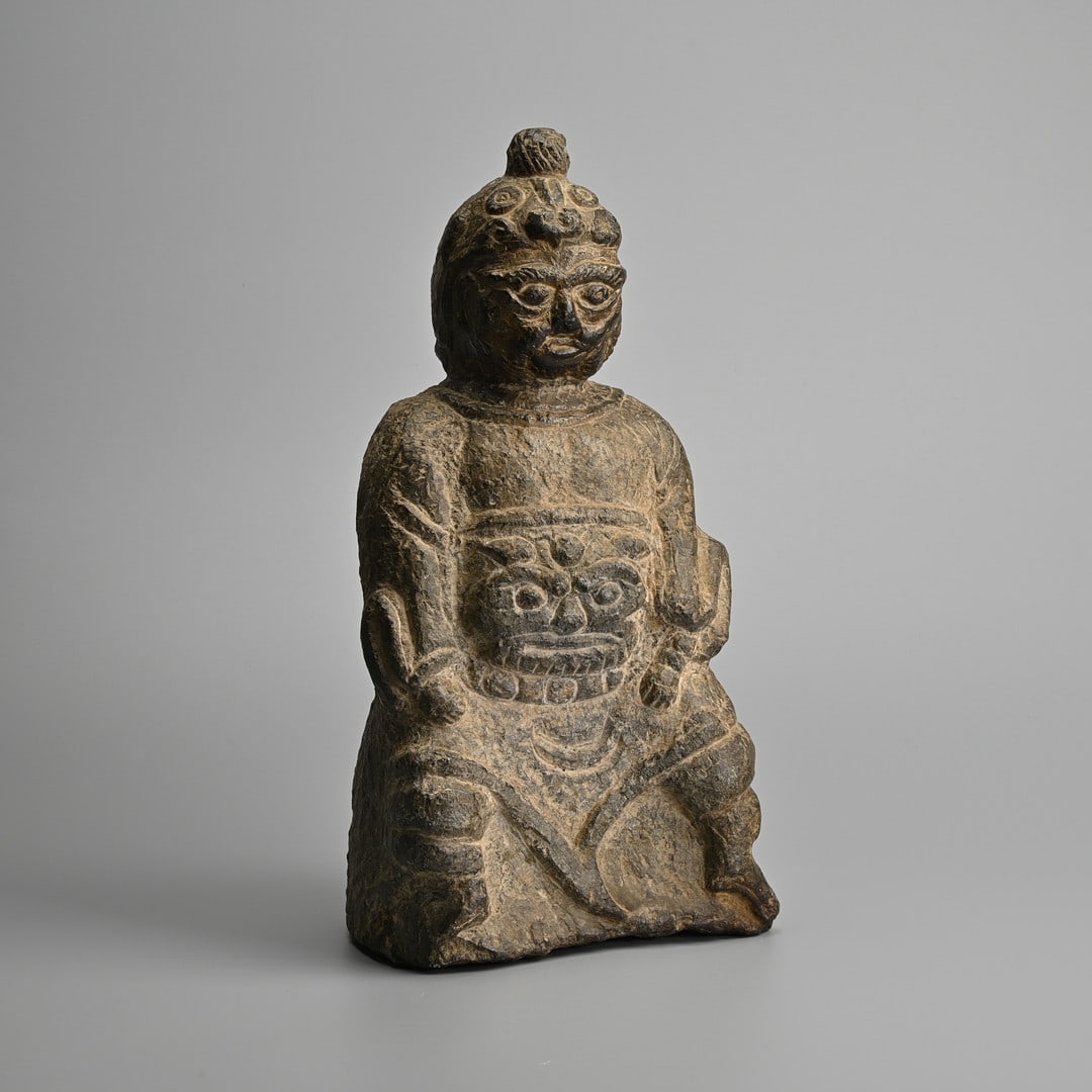 A CHINESE CARVED STONE FIGURE OF A SEATED GENERAL, LATE MING DYNASTY. (1 of 7)