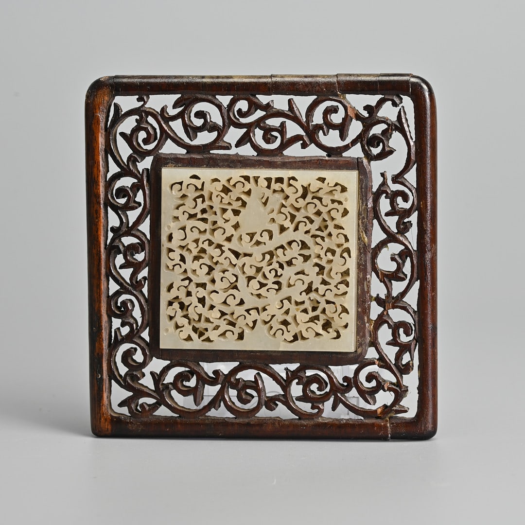 A CHINESE PALE CELADON JADE PLAQUE MOUNTED IN WOODEN FRAME, QING DYNASTY. (1 of 5)