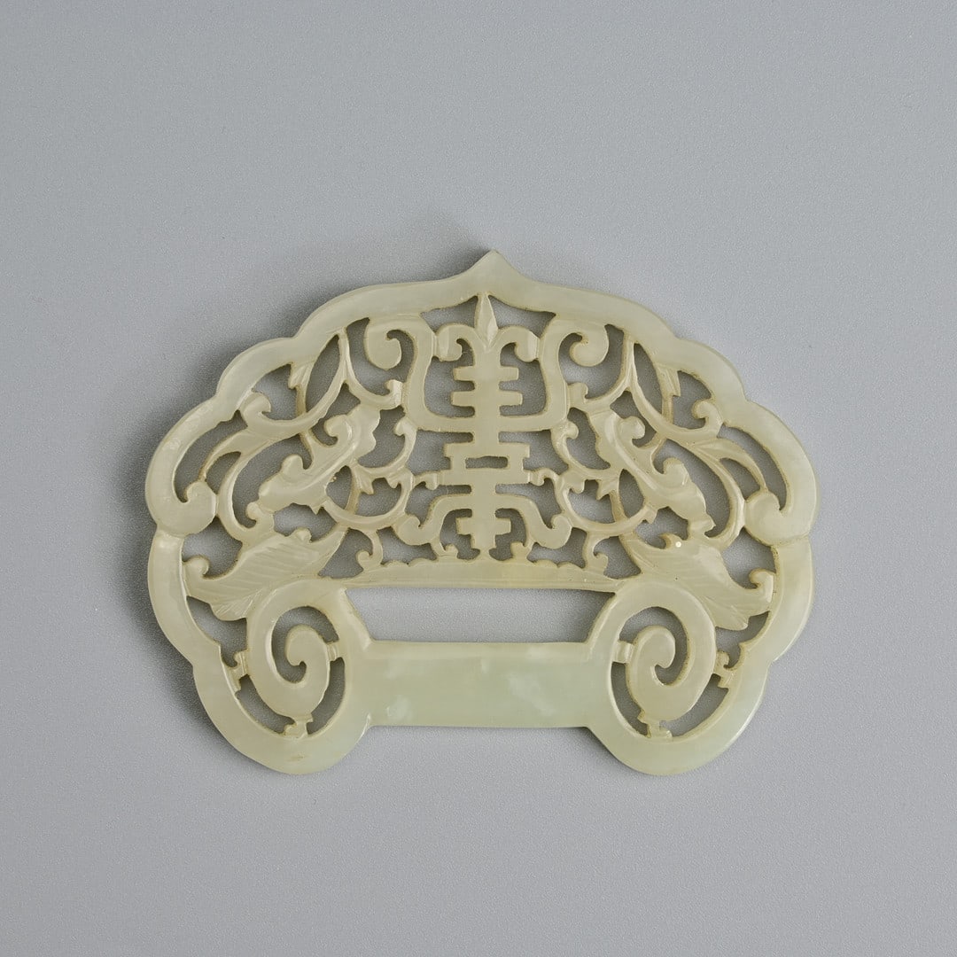 A CHINESE PALE CELADON JADE 'SHOU' RUYI LOCK-SHAPED PENDANT, QING DYNASTY. (1 of 5)