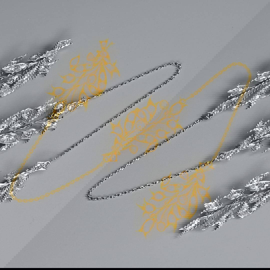 A PERANAKAN HIGH CARAT YELLOW-GOLD AND DIAMOND MOUNTED KEROSANG, 20TH CENTURY, UNMARKED.