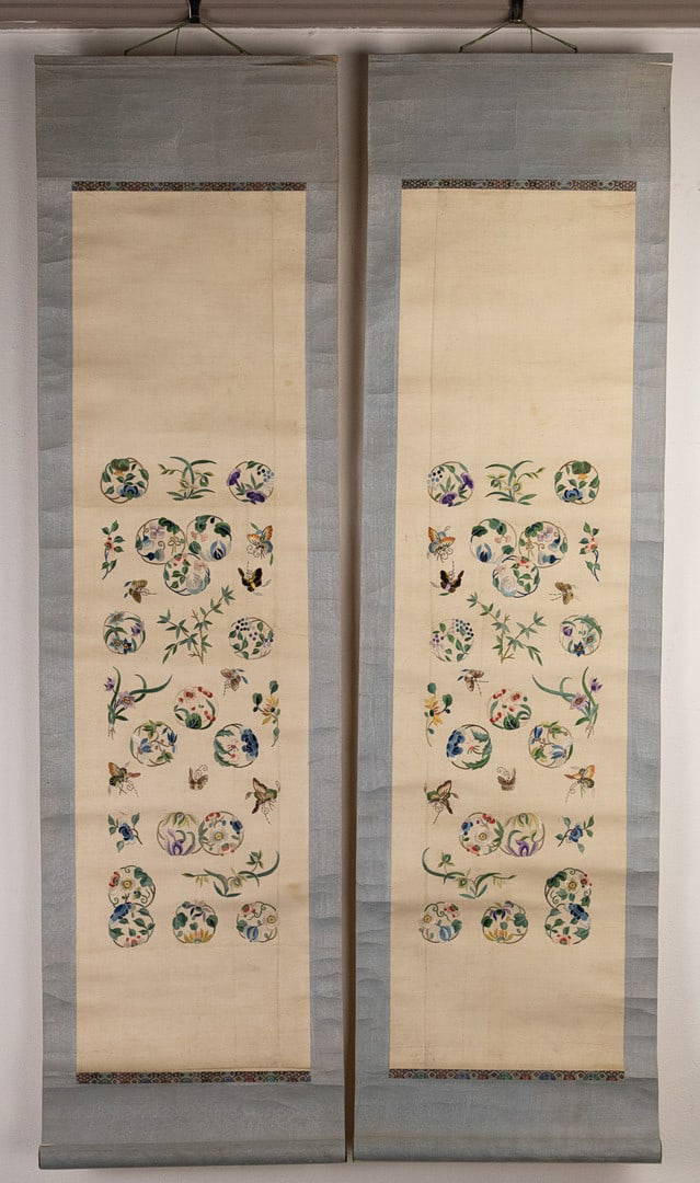 A MIRRORED PAIR OF CHINESE SILK EMBROIDERED PANELS MOUNTED IN SCROLLS, EARLY 20TH CENTURY.