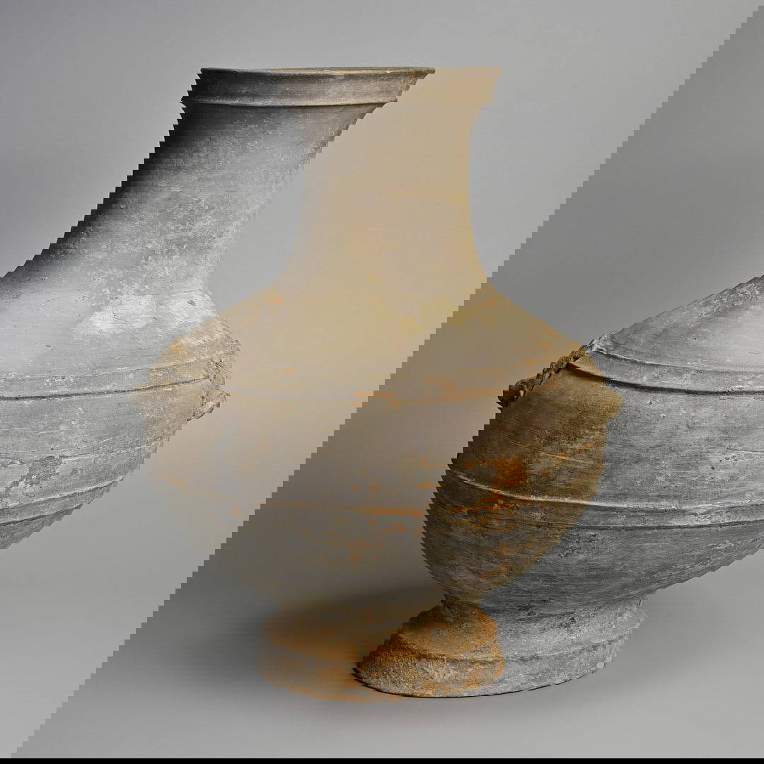 A LARGE CHINESE GREY POTTERY HU JAR, HAN DYNASTY (206BC - 220AD).