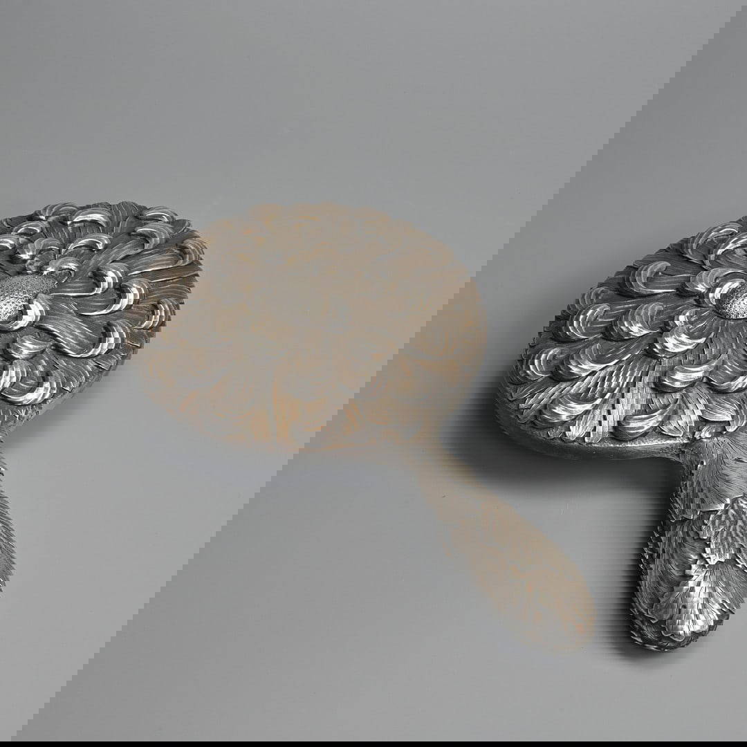 A JAPANESE SILVER HAND MIRROR, MEIJI / TAISHO PERIOD.