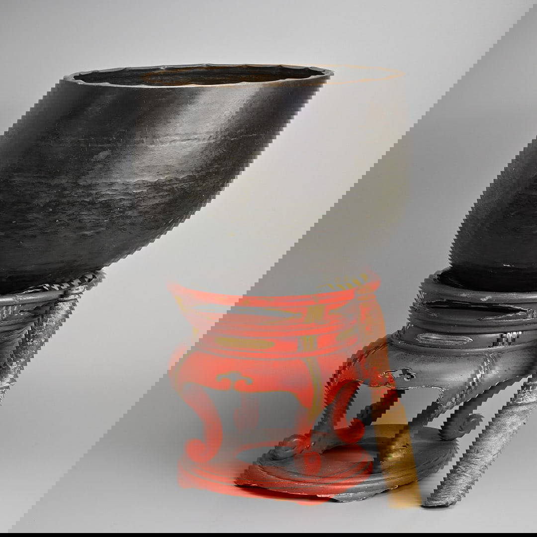 A LARGE JAPANESE BRONZE BUDDHIST GONG, DOBACHI, RAISED ON A RED LACQUER AND GILT STAND, 19/20TH