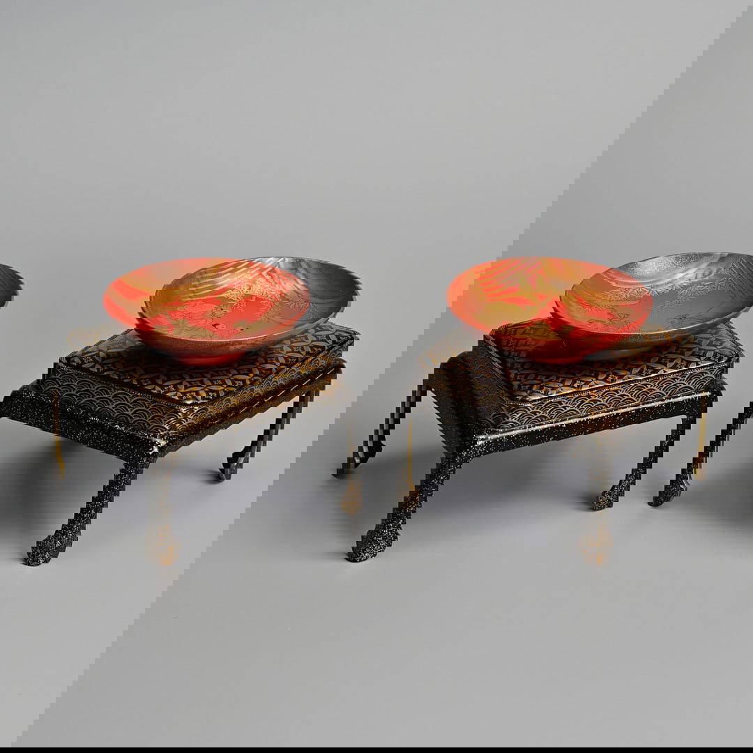 A PAIR OF JAPANESE SAKE CUPS (SAKAZUKI) AND STANDS, IN BOXES, EARLY 20TH CENTURY.