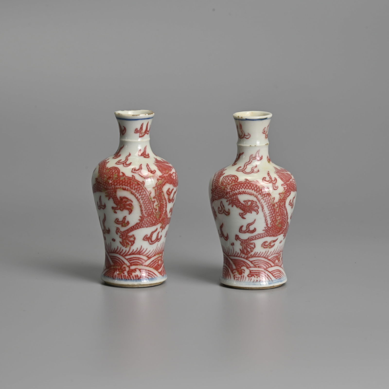 TWO RARE CHINESE UNDERGLAZE COPPER RED AND WHITE MINIATURE PORCELAIN 'DRAGON' VASES, 19TH CENTURY. (1 of 10)