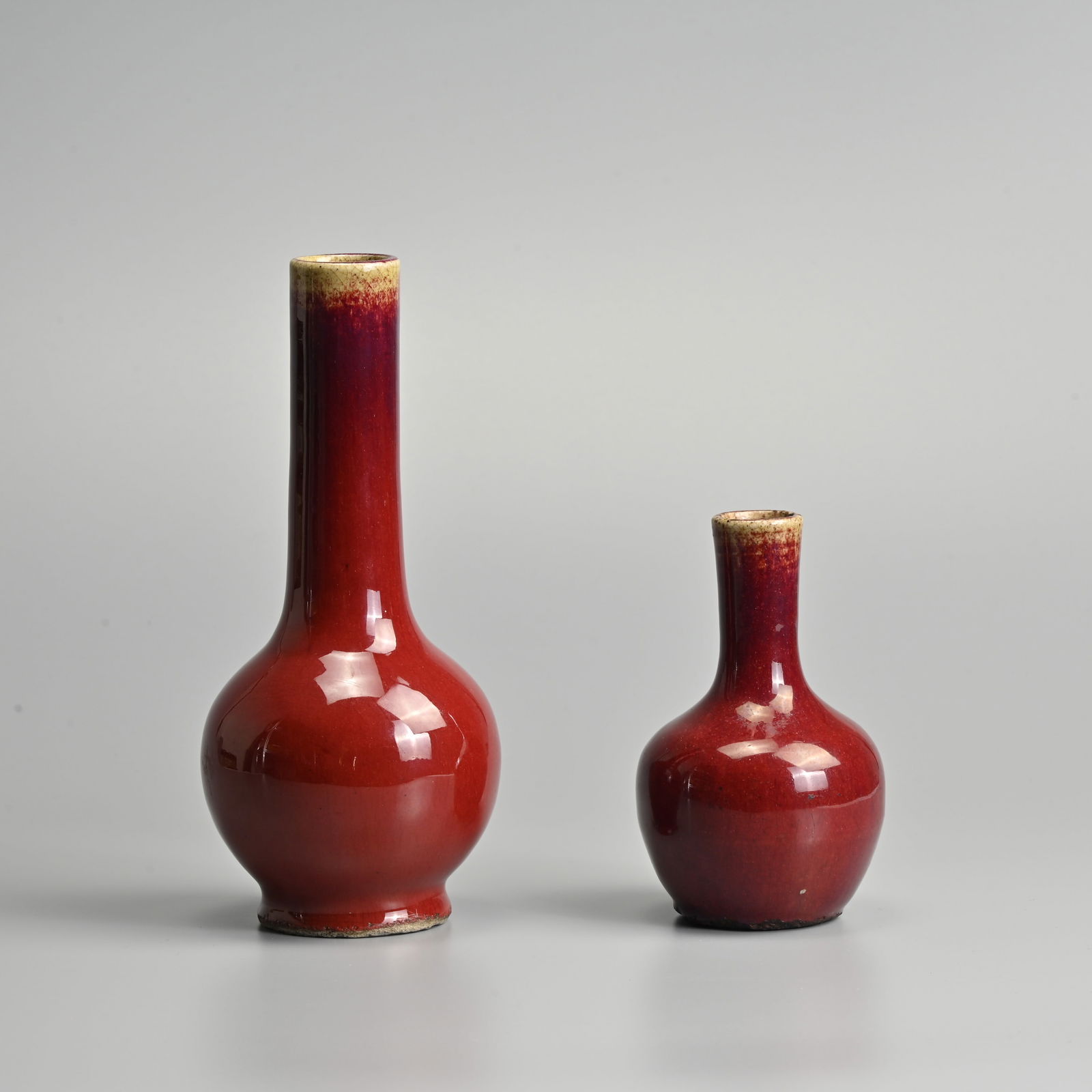 TWO CHINESE SANG DE BOEUF PORCELAIN BOTTLE VASES, QING DYNASTY. (1 of 17)