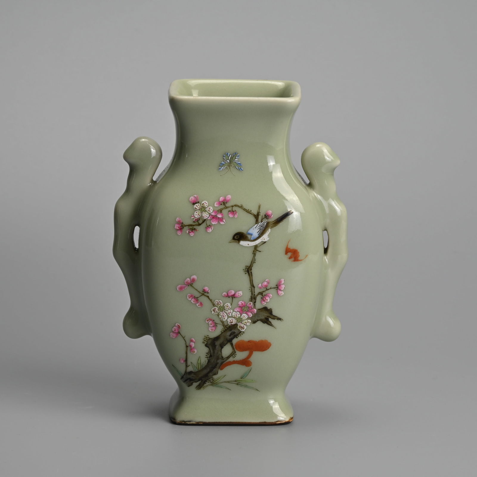 A CHINESE CELADON-GROUND FAMILLE ROSE PORCELAIN VASE. (1 of 7)