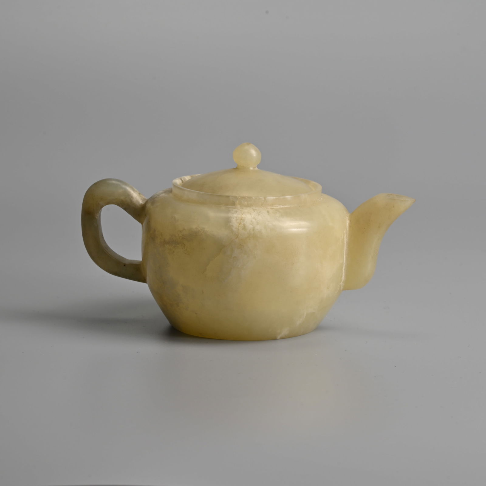 A CHINESE CARVED JADE TEAPOT AND COVER, QING / REPUBLIC PERIOD. (1 of 10)