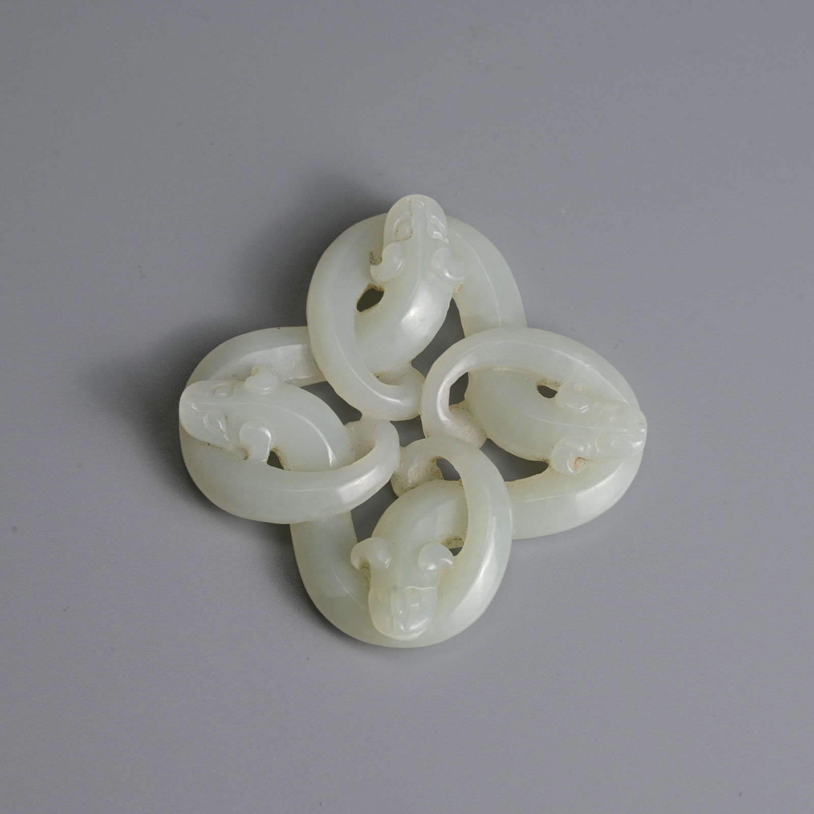 A CHINESE WHITE JADE 'SERPENT' PENDANT. (1 of 4)