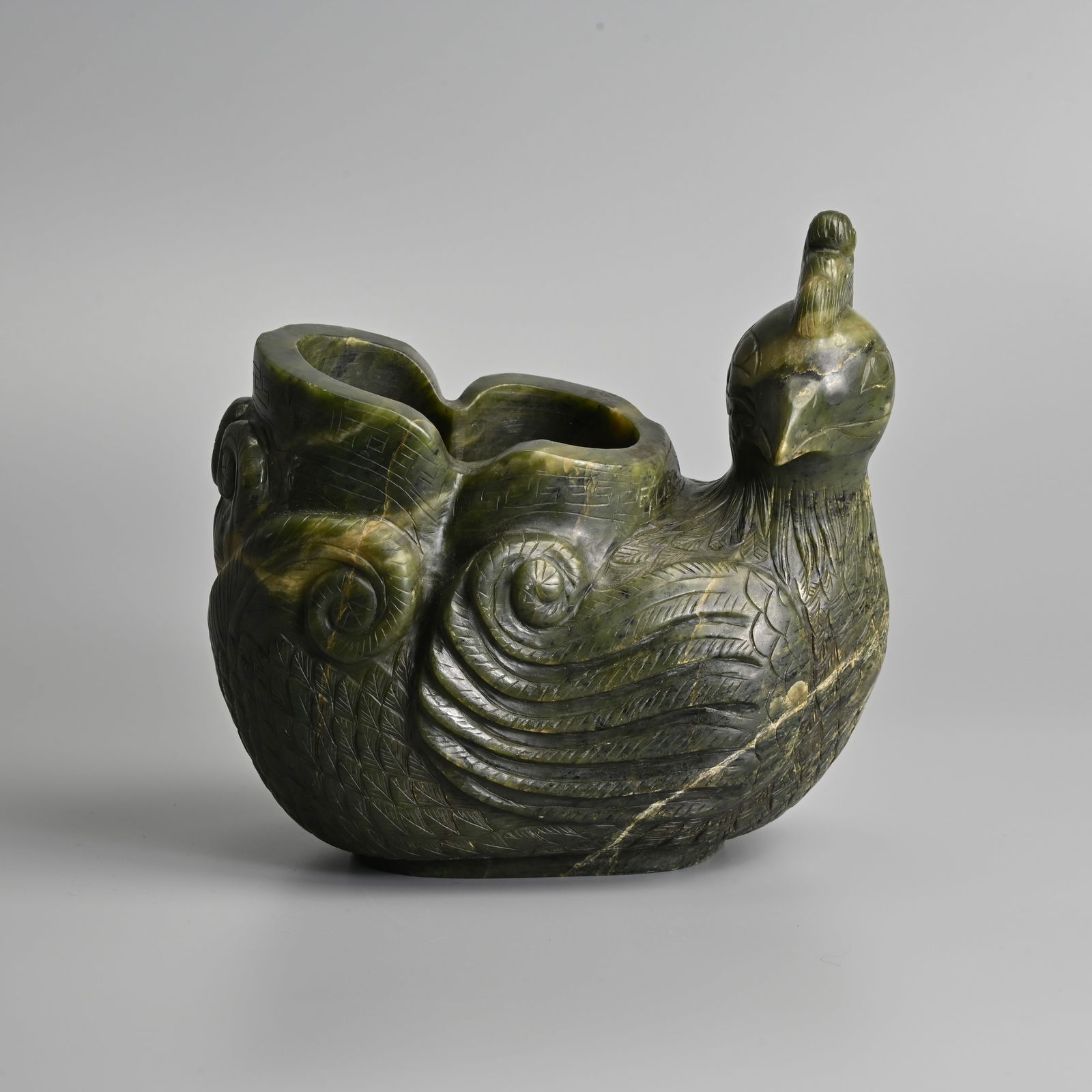 A LARGE CHINESE SPINACH COLOURED JADE POT IN THE FORM OF A CHICKEN, 20TH CENTURY.: A LARGE CHINESE SPINACH COLOURED JADE POT IN THE FORM OF A CHICKEN, 20TH CENTURY. Heavy stone carved in the form of a chicken with an open section to the back. 21cm length x 19cm tall. Weight 5.35KG.