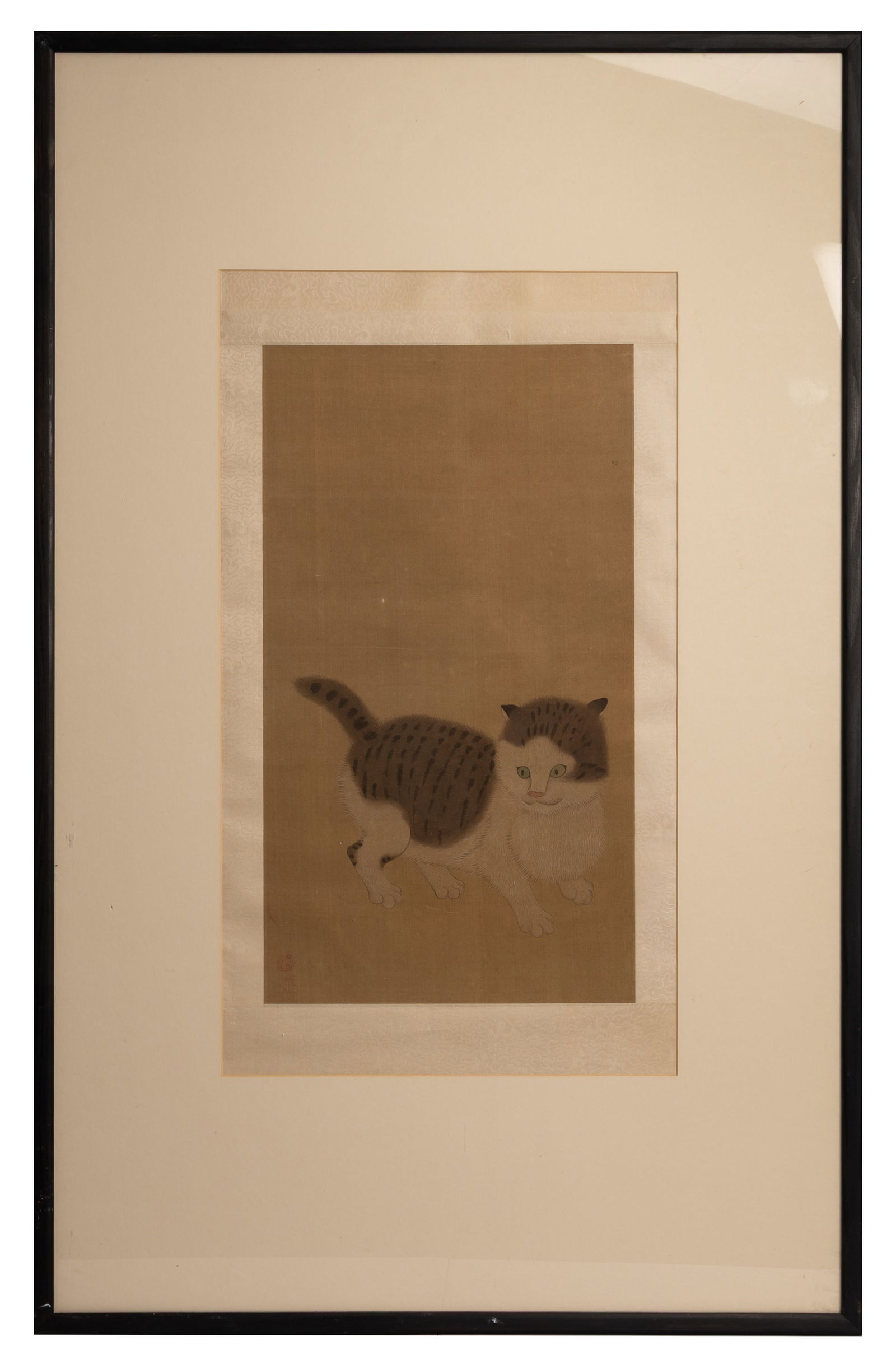 A LARGE FRAMED CHINESE PAINTING ON SILK OF A CAT, QING DYNASTY.: A LARGE FRAMED CHINESE PAINTING ON SILK OF A CAT, QING DYNASTY. Signed with two red seals, within a white silk border, later framed. Artwork 58 cm x 32.5 cm, 115 cm 73 cm overall. Condition: Overall i