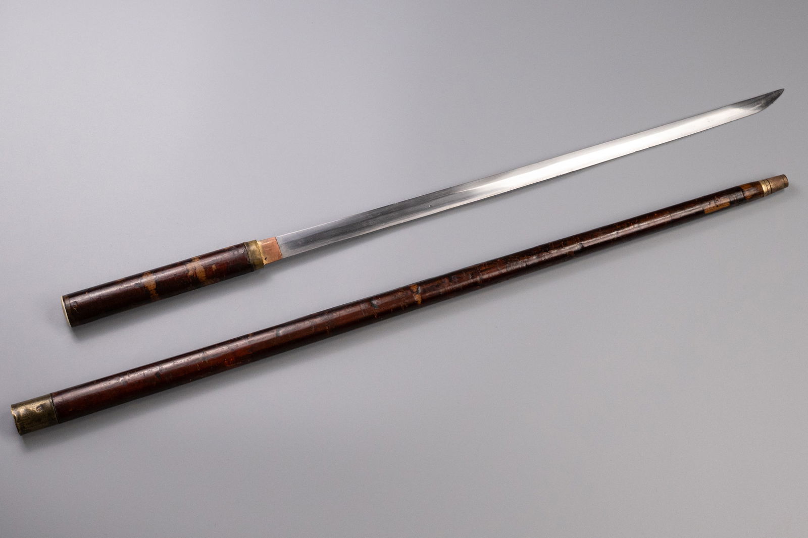 A JAPANESE IVORY AND BRASS MOUNTED SHIKOMIZUE (SWORD STICK), MEIJI PERIOD (1868-1912). (1 of 11)