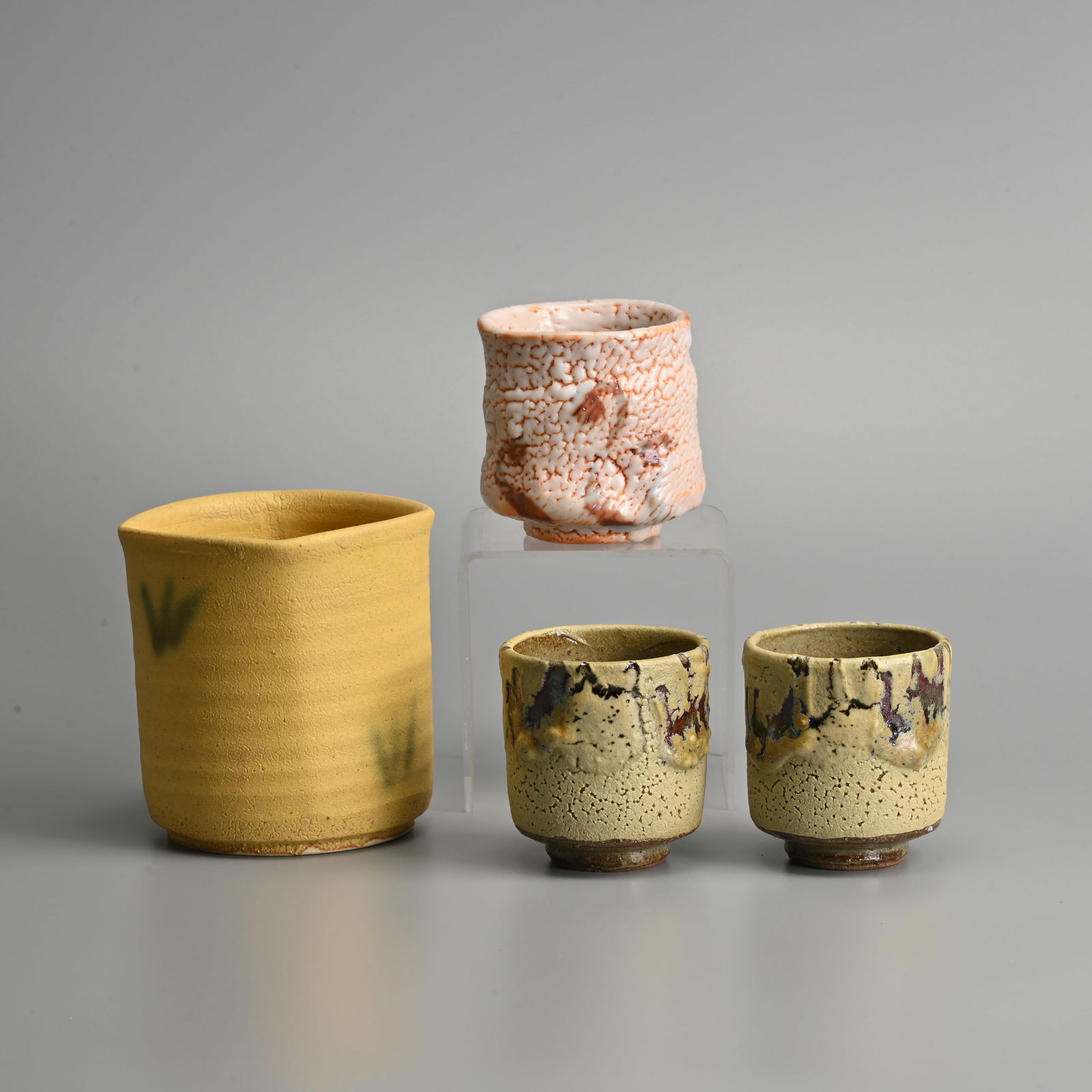 A JAPANESE SETO YELLOW-GROUND POTTERY BRUSH-POT, A SHINO GLAZED POTTERY YUNOMI AND A PAIR OF SHINO G (1 of 20)