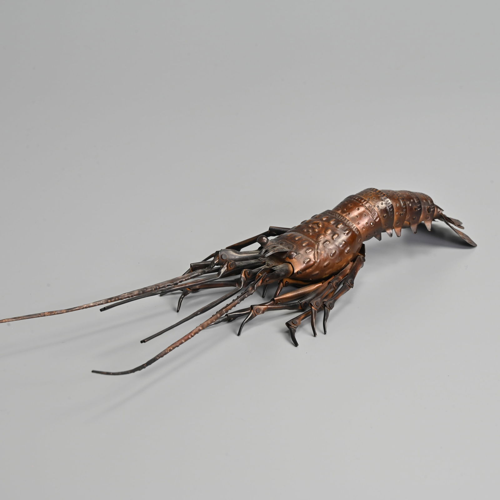 JAPANESE LATE MEIJI PERIOD COPPER JIZAI OKIMONO ARTICULATED CRAYFISH, EARLY 20TH CENTURY.: JAPANESE LATE MEIJI PERIOD COPPER JIZAI OKIMONO ARTICULATED CRAYFISH, EARLY 20TH CENTURY. Naturalistically modelled with a fully articulated body, the surface of the exoskeleton is intricately worked,