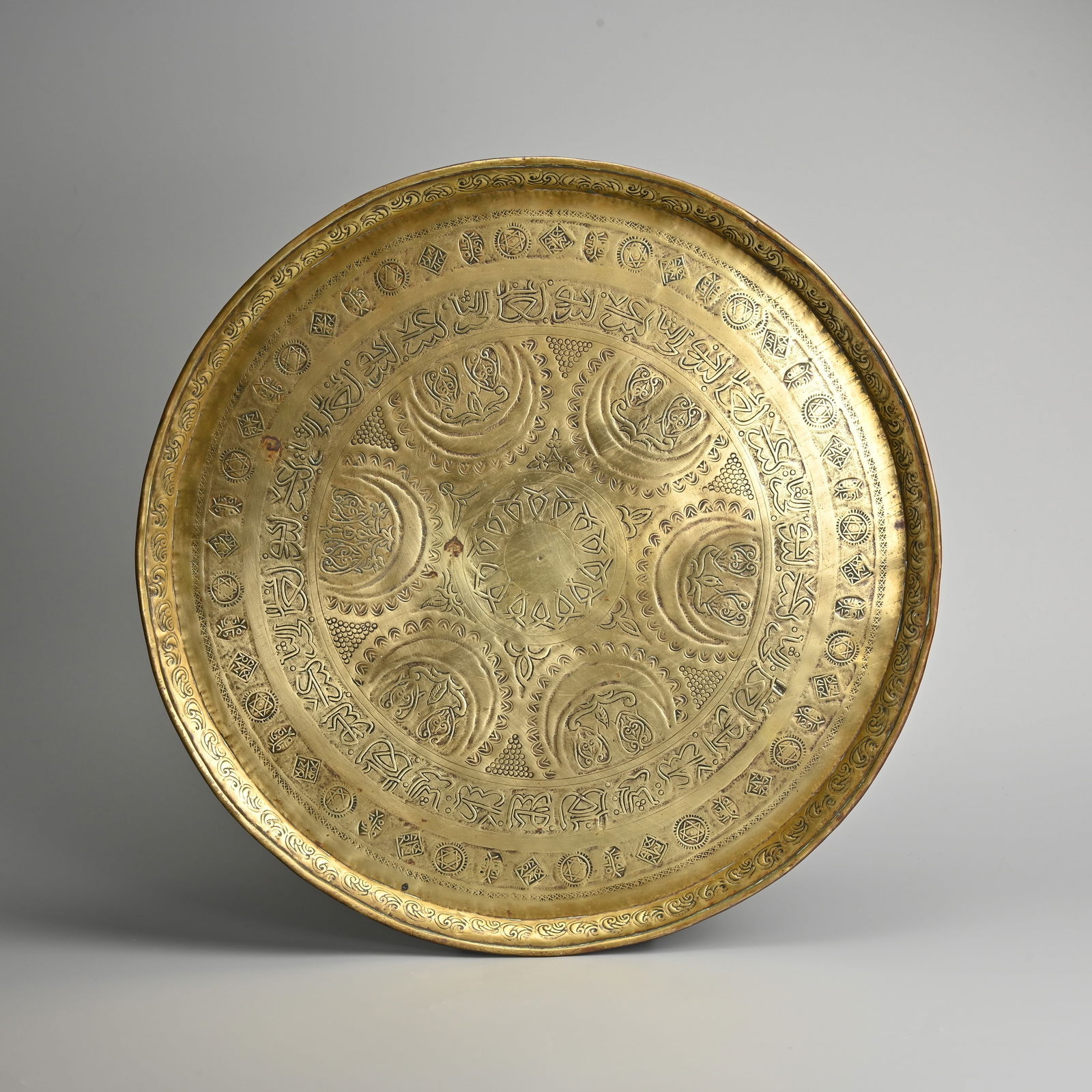 A LARGE LATE 19TH CENTURY ISLAMIC MIDDLE EASTERN BRASS TRAY, DATED 1291 AH (CIRCA 1874). (1 of 4)