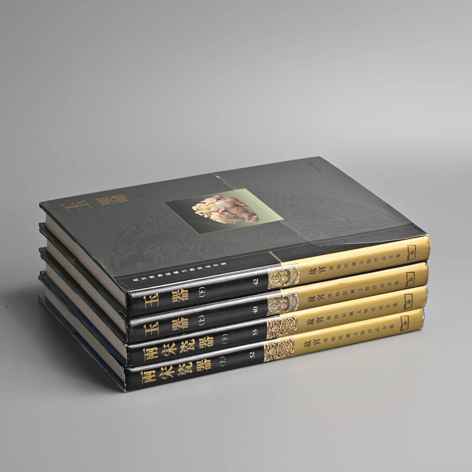 FOUR VOLUMES FROM THE SERIES ON THE COMPLETE COLLECTION OF TREASURES OF THE PALACE MUSEUM.: FOUR VOLUMES FROM THE SERIES ON THE COMPLETE COLLECTION OF TREASURES OF THE PALACE MUSEUM. Hong Kong, 1995-6, Comprising: vols. 32 & 33, Porcelain of the Song Dynasty I & II; Vol. 4 Jadeware; Vol. 42,