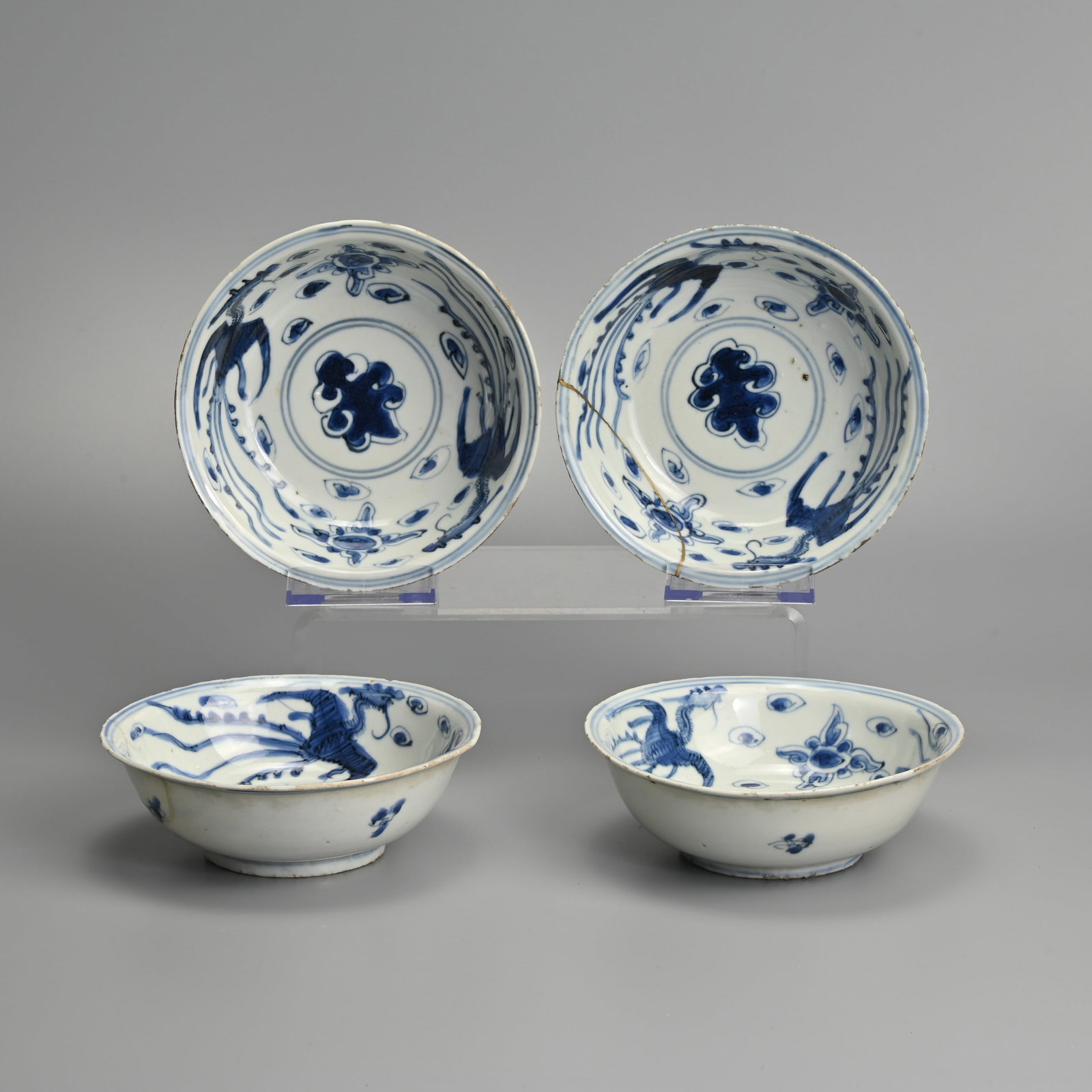 FOUR CHINESE KO-SOMETSUKE PORCELAIN BLUE AND WHITE PHOENIX DISHES, LATE MING DYNASTY, TIANQI PERIOD: The interior of each painted with two phoenix and two lotus flowers centred by a leaf, within double concentric lines, the exterior with leaves, 14.3 cm diam. (4) Provenance: Private collection, Japan