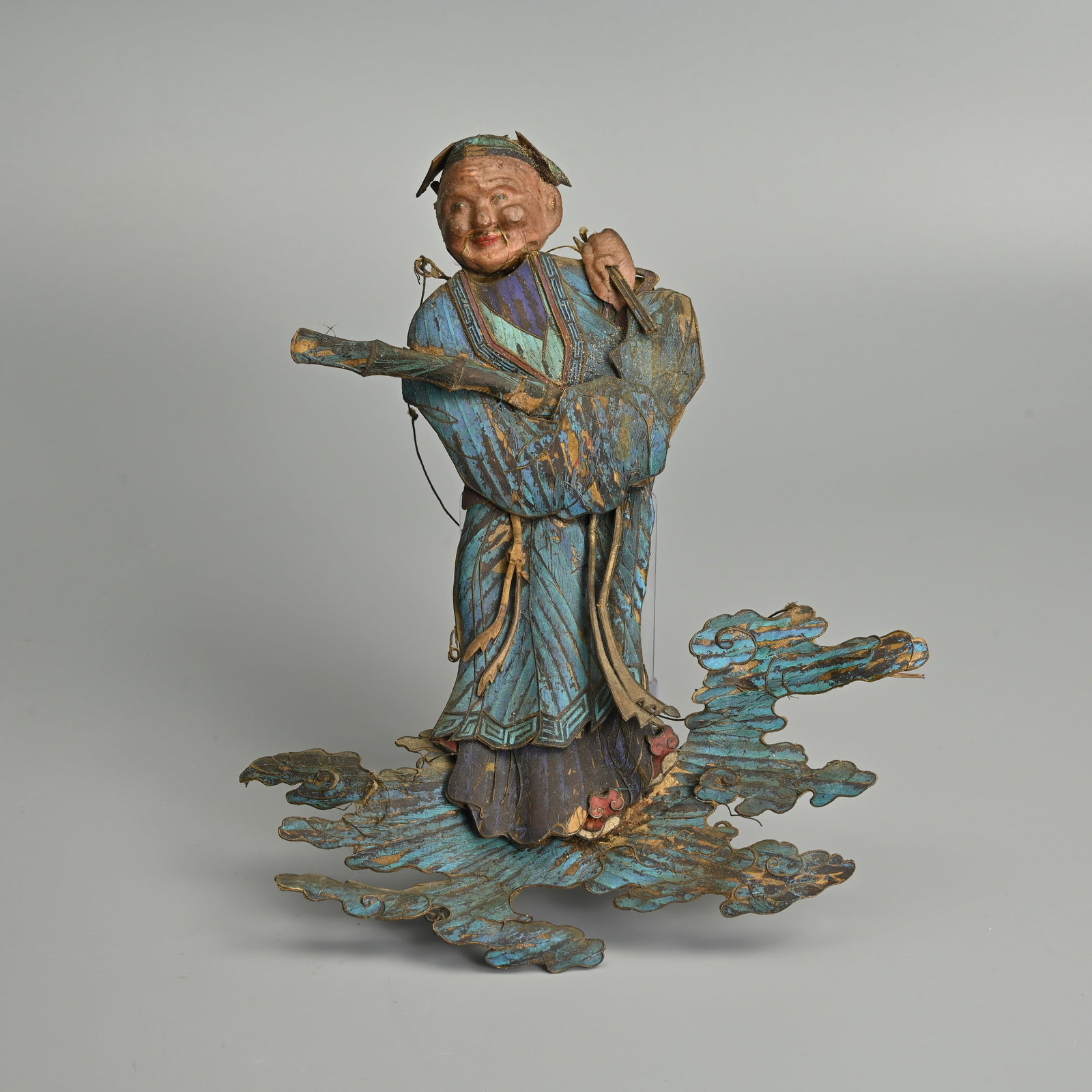 A LARGE RARE AND UNUSUAL KINGFISHER EMBELLISHED BUFFALO HIDE FIGURE OF AN IMMORTAL ON CLOUDS, QING (1 of 9)