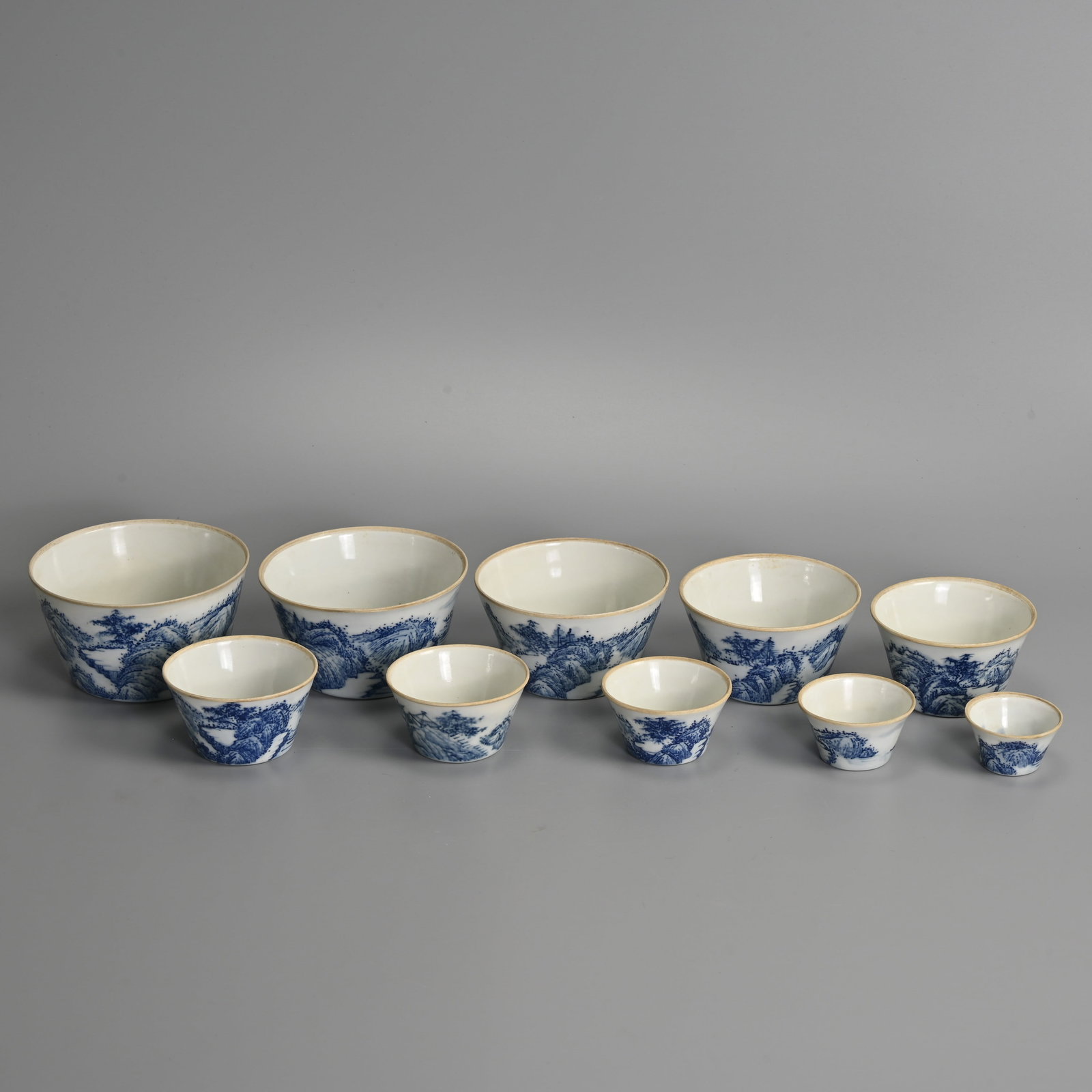 A SET OF TEN CHINESE BLUE AND WHITE PORCELAIN GRADUATED CUPS, DAOGUANG MARK. (1 of 10)