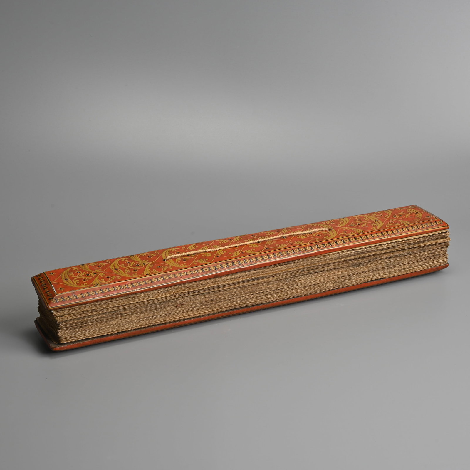 A PALM LEAF BUDDHIST MANUSCRIPT WITH FINELY DECORATED LACQUERED COVERS, SRI LANKA, 19TH CENTURY. (1 of 8)