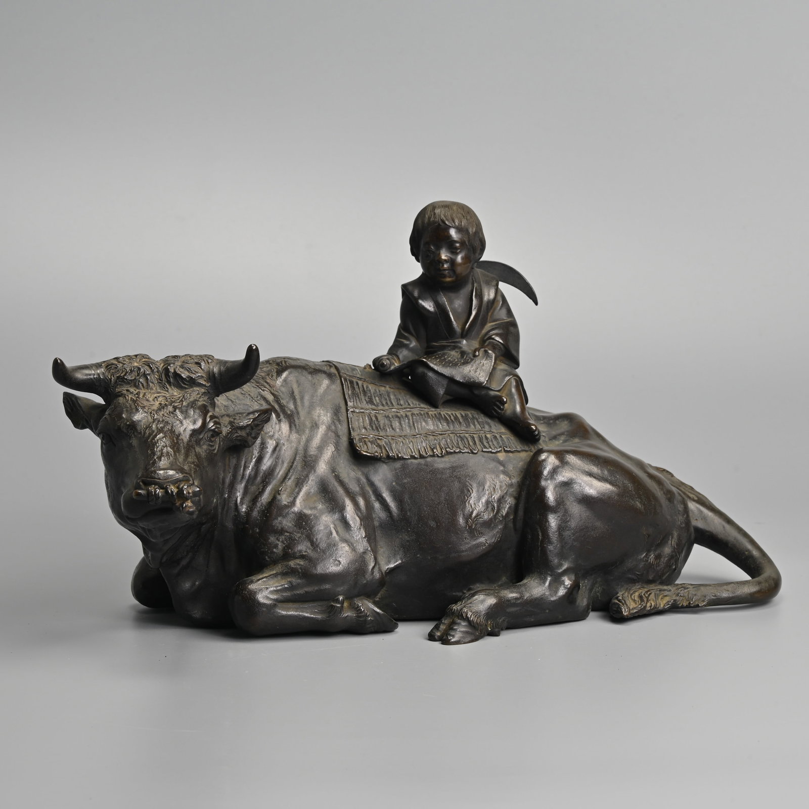 A FINE JAPANESE BRONZE OKIMONO OF A BOY ON AN OX. (1 of 7)