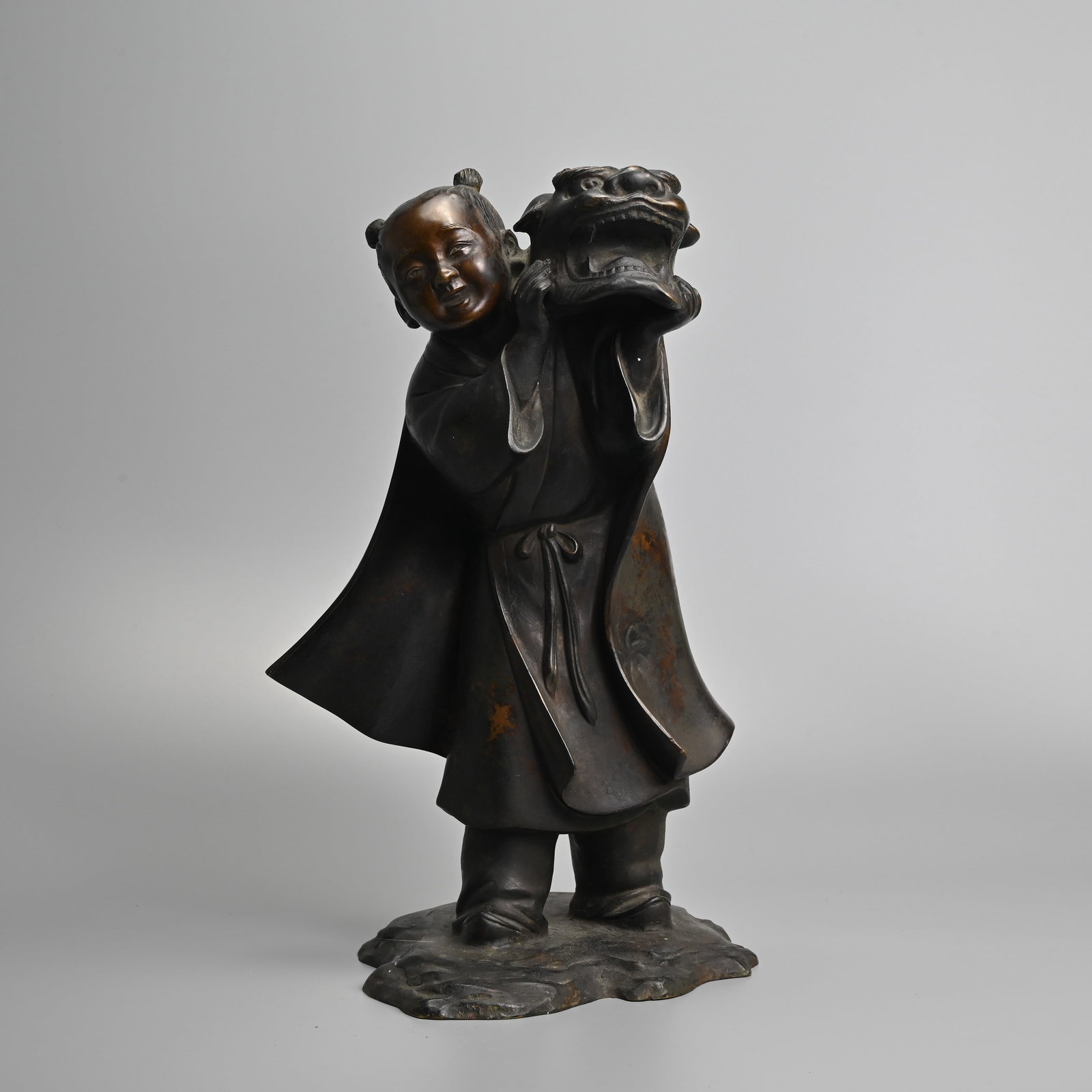 A JAPANESE BRONZE OKIMONO OF A BOY, 'DRAGON DANCE', HOZAN YOSHIYAMA, LATE MEIJI PERIOD. (1 of 9)