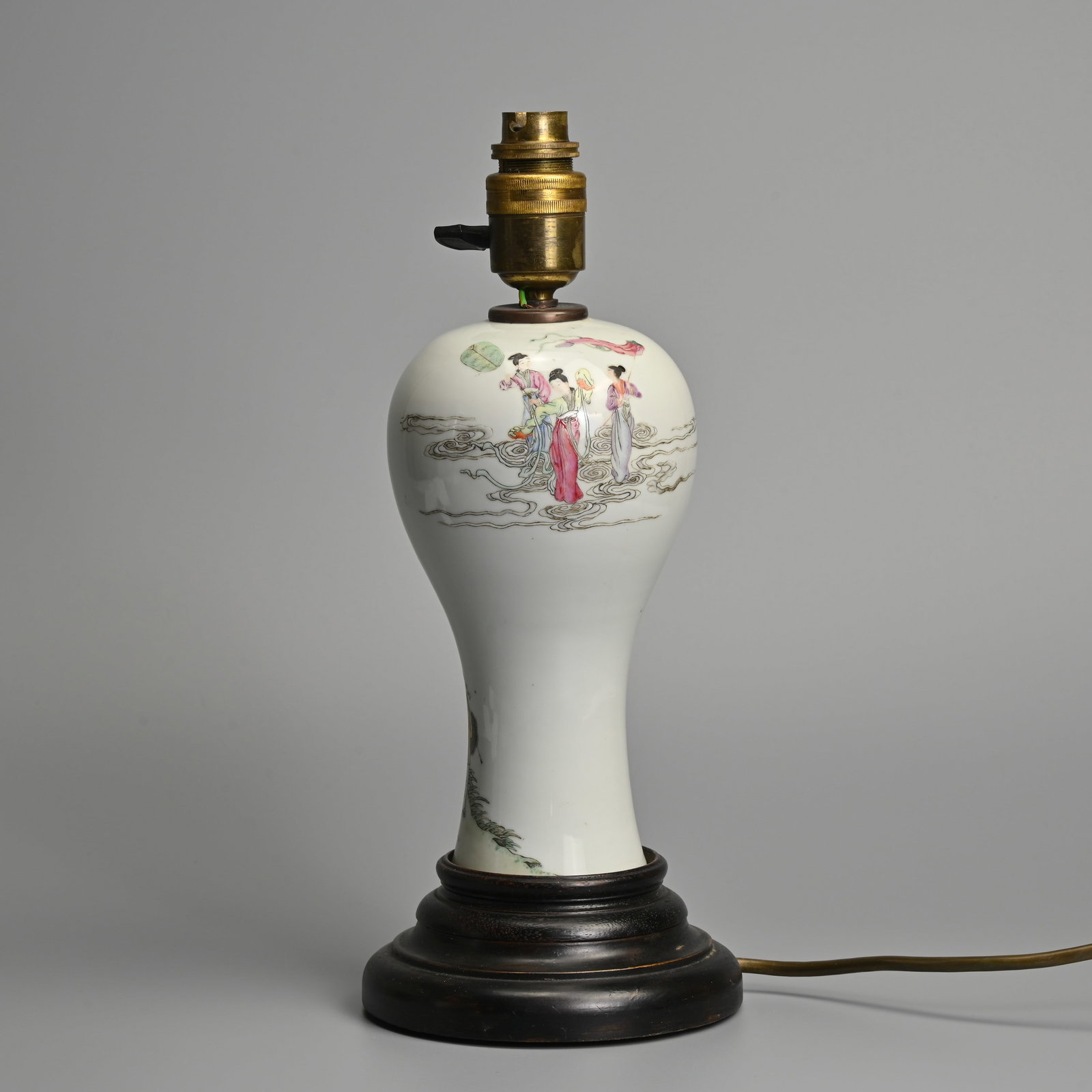 A CHINESE REPUBLIC PERIOD FAMILLE ROSE PORCELAIN VASE CONVERTED TO A LAMP BASE.: A CHINESE REPUBLIC PERIOD FAMILLE ROSE PORCELAIN VASE CONVERTED TO A LAMP BASE. Featuring a fisherman looking up at the Three Heavenly Maidens standing on clouds. The vase approx. 21cm tall. Mounted o